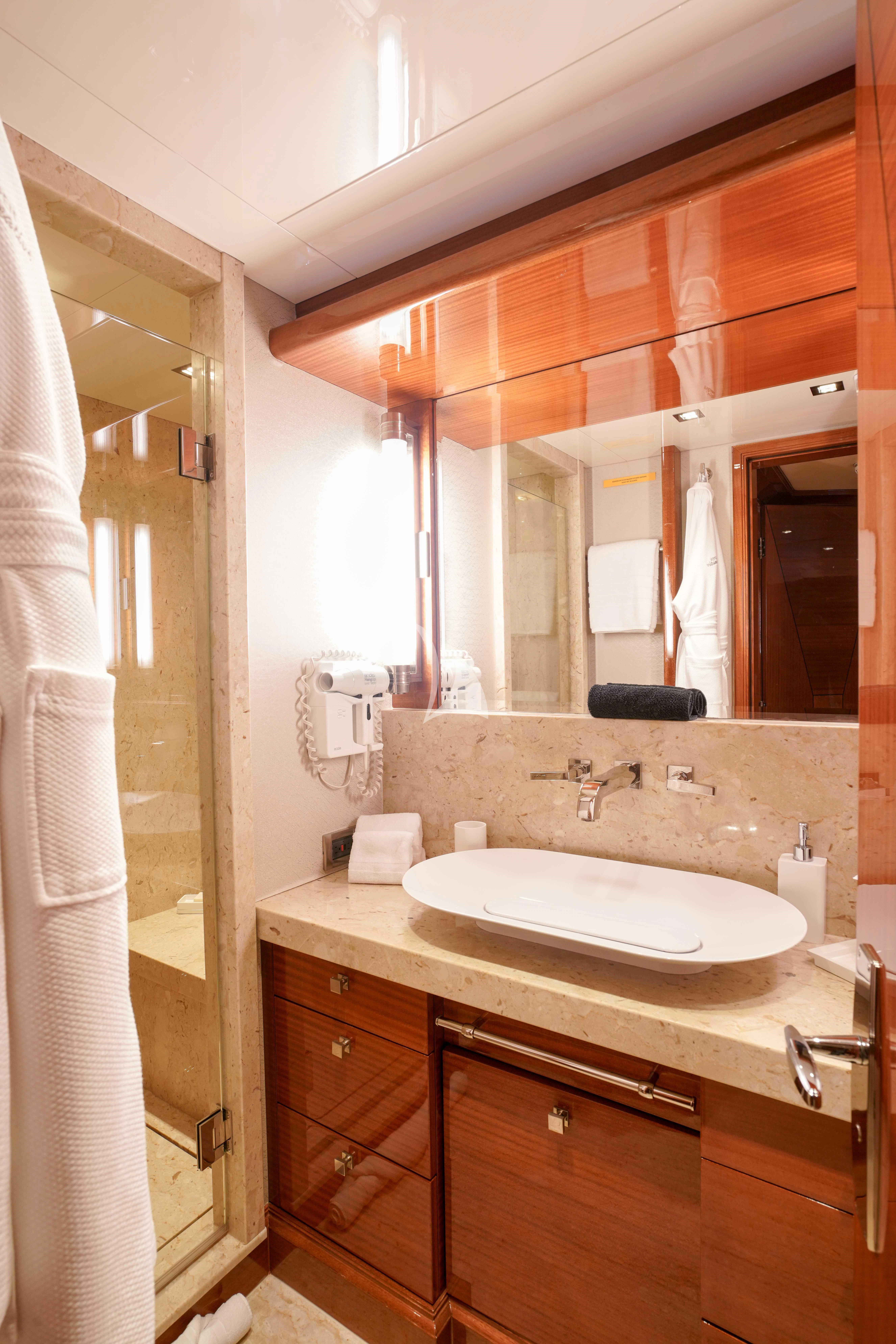 a bathroom with a sink and a mirror aboard ASPEN ALTERNATIVE Yacht for Charter