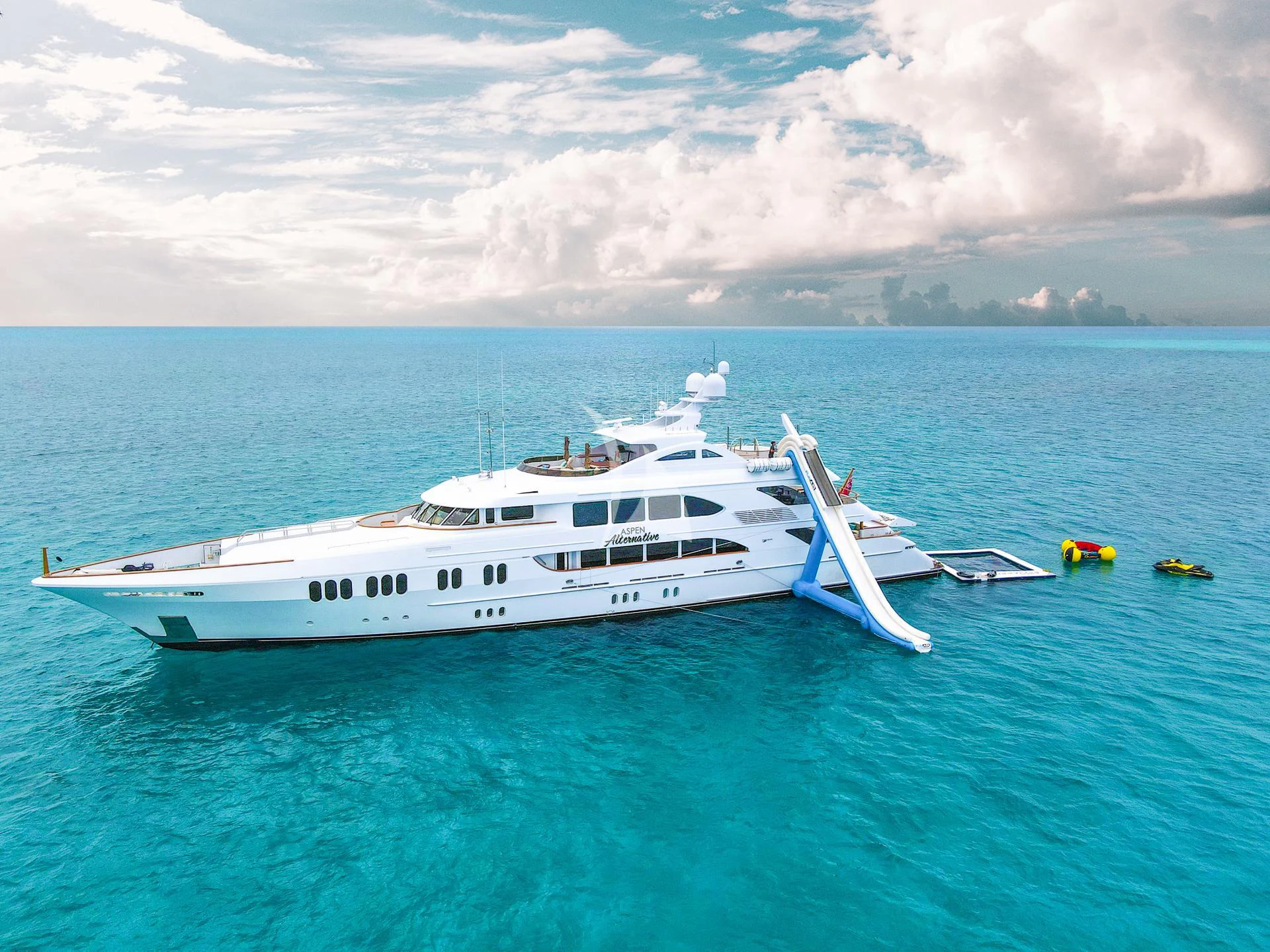 a white yacht in the water aboard ASPEN ALTERNATIVE Yacht for Charter