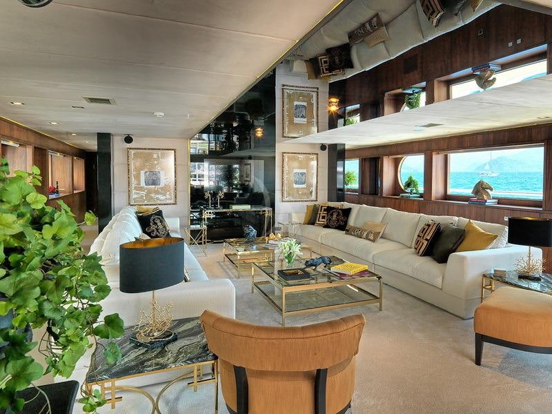 a living room with a large window aboard QUEEN MARE Yacht for Charter