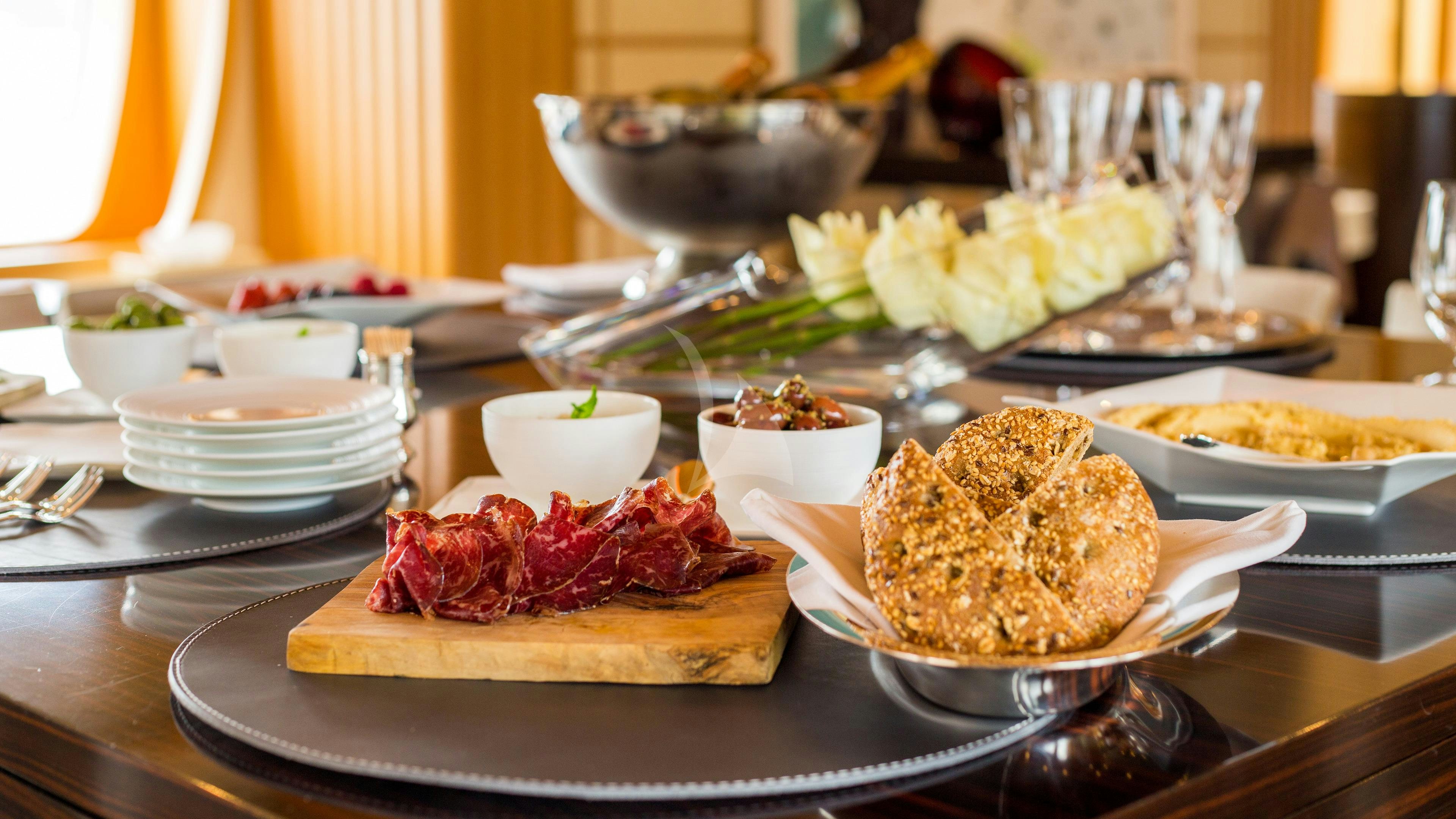 a table full of food aboard ADVENTURE Yacht for Charter