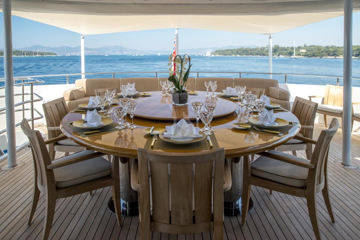 a table set for a dinner aboard SIROCCO Yacht for Charter