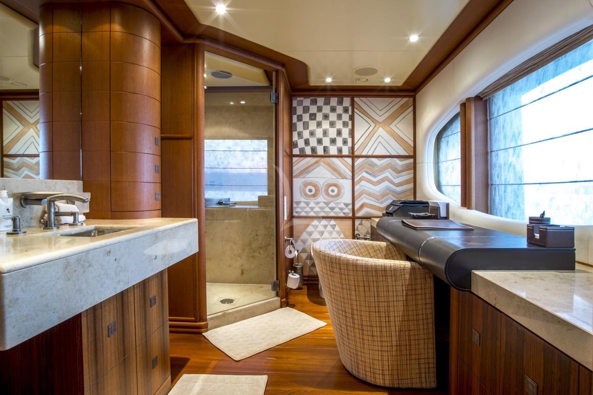 a room with a sink and a couch aboard SIROCCO Yacht for Charter