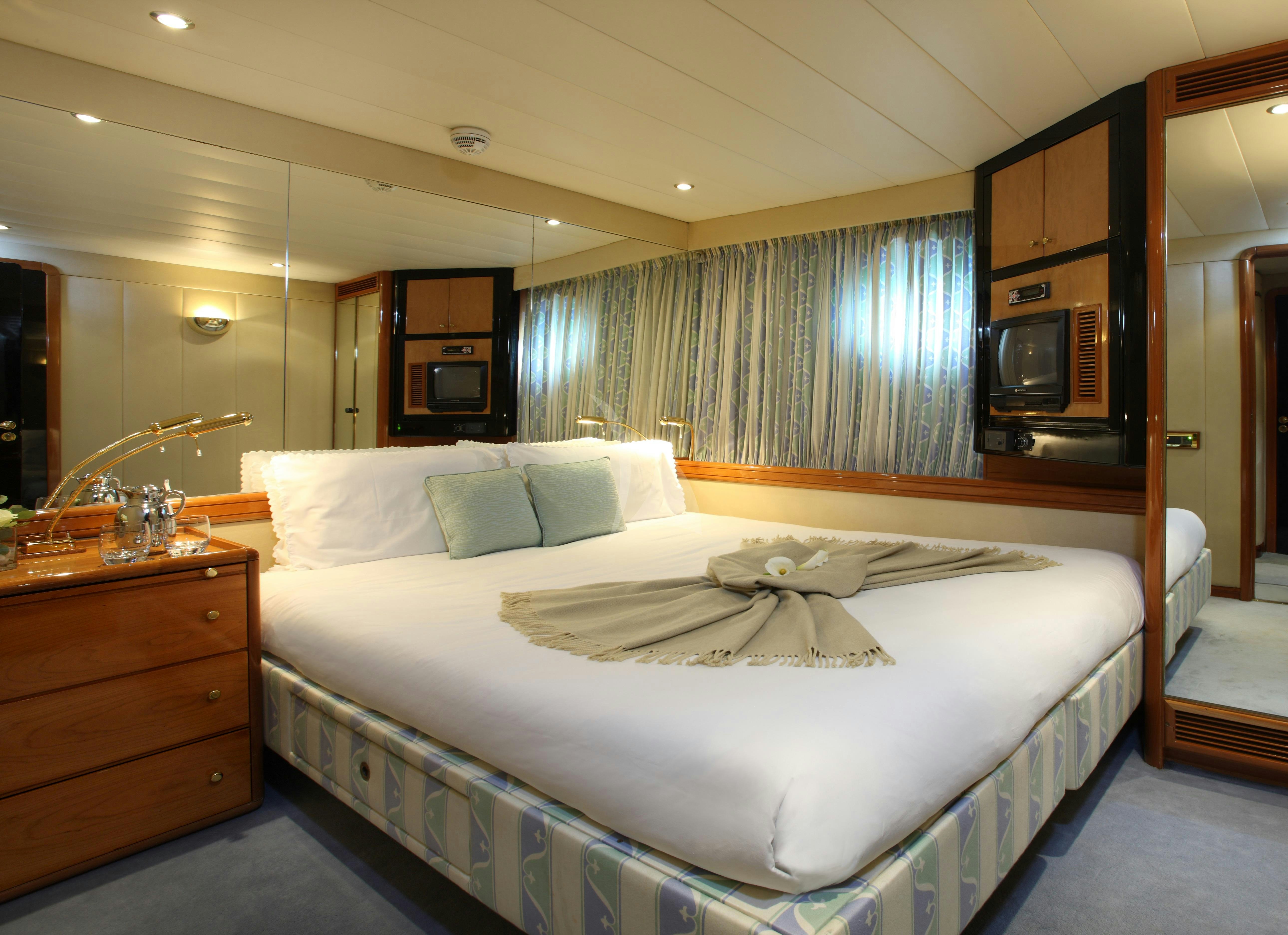 a hotel room with a bed aboard UNPLUGGED Yacht for Charter