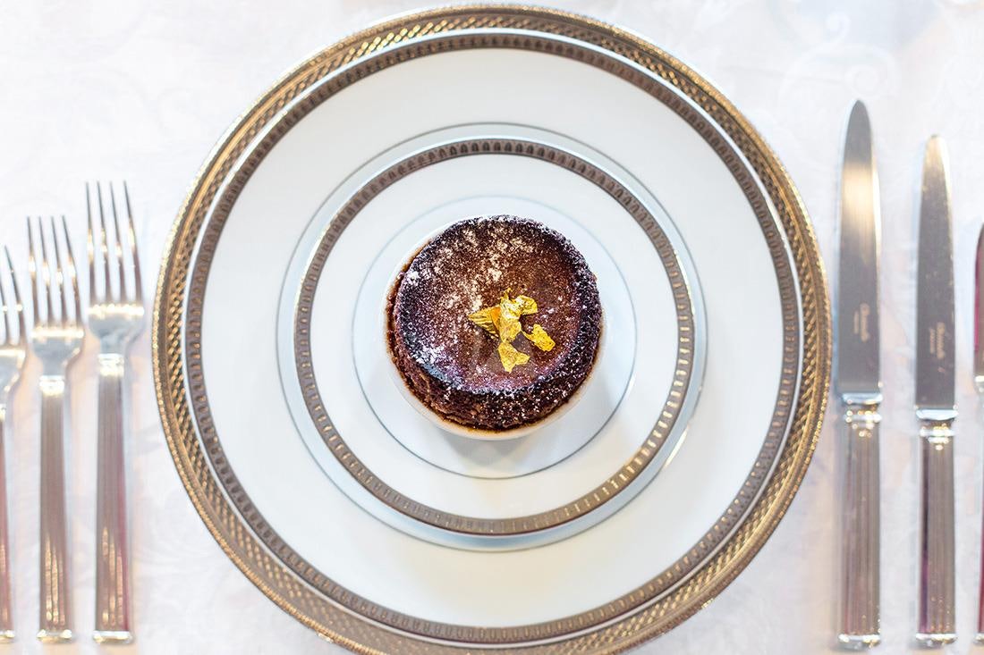 a plate with a cake on it aboard ESMERALDA Yacht for Charter