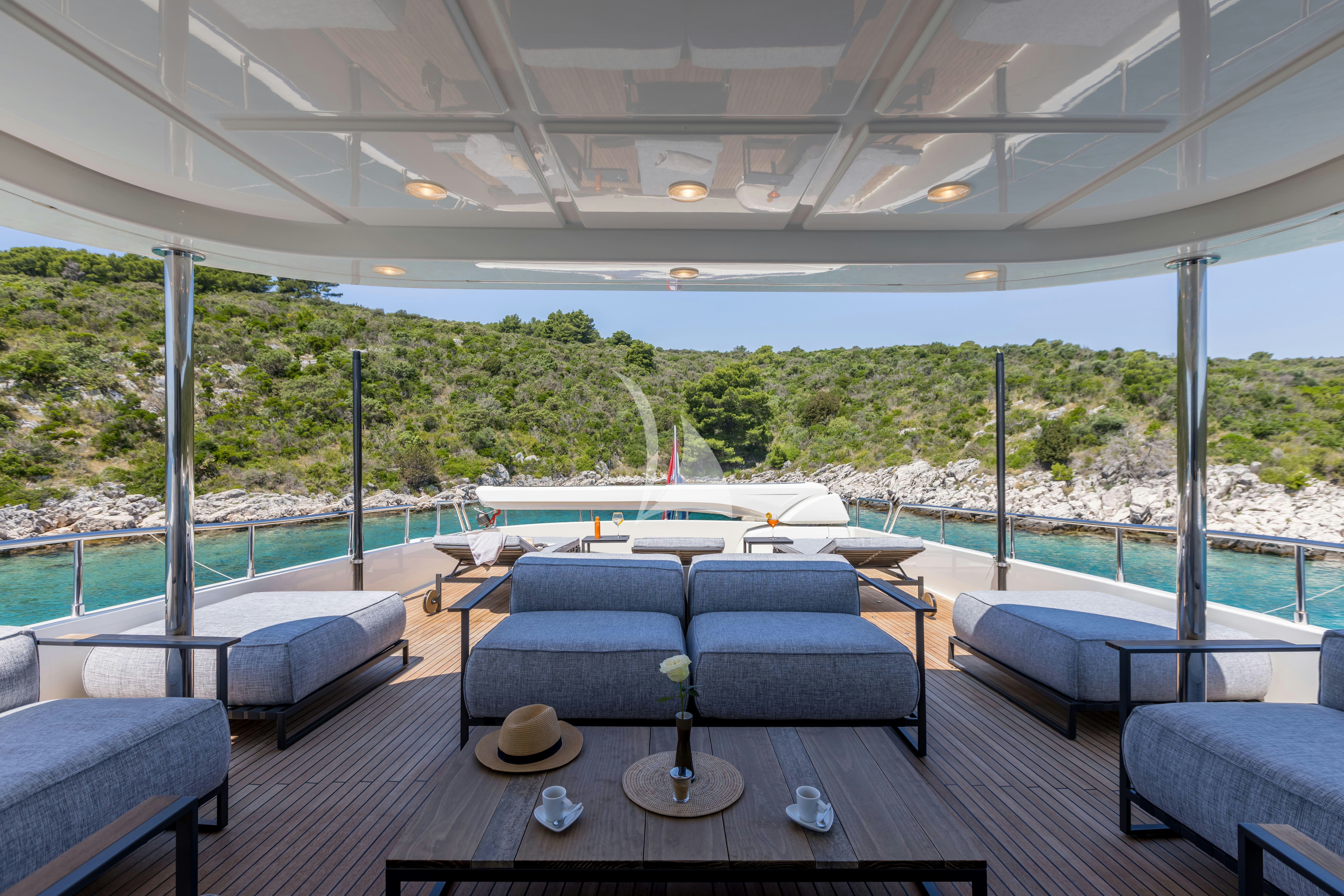 a large room with a table and chairs aboard KLOBUK Yacht for Charter