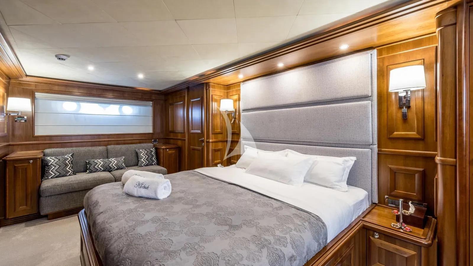 a large bed in a room aboard KLOBUK Yacht for Charter
