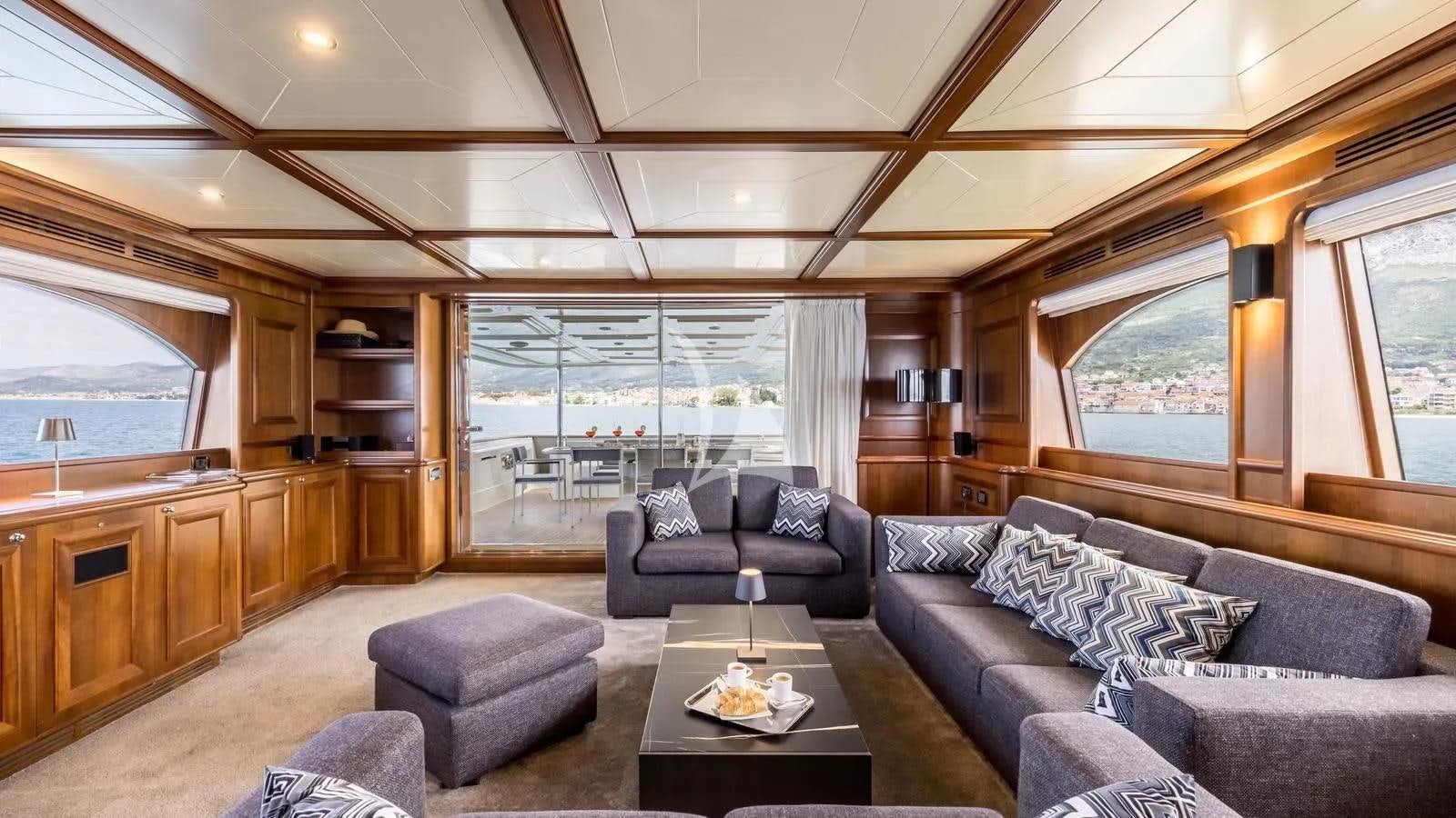 a living room with a large window aboard KLOBUK Yacht for Charter
