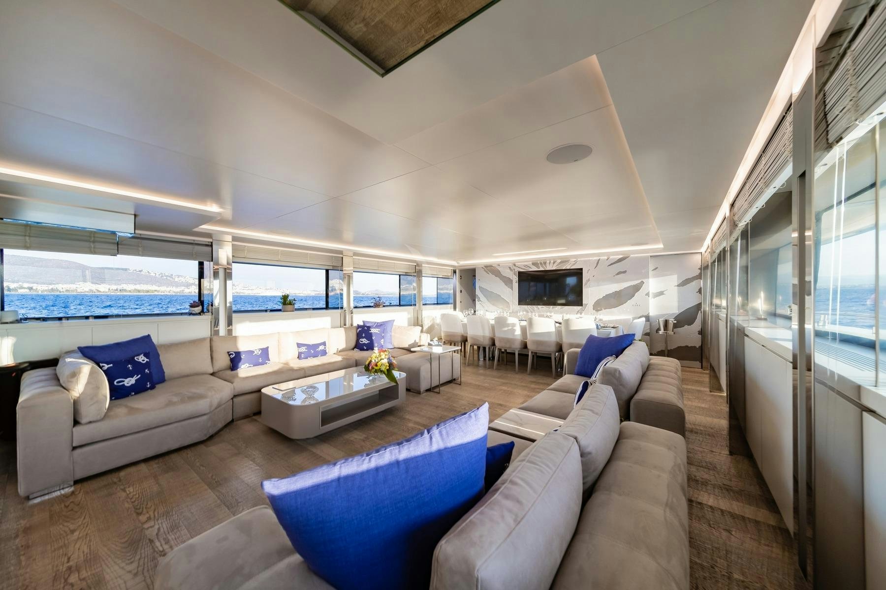 a living room with a large window aboard SEA WOLF Yacht for Charter