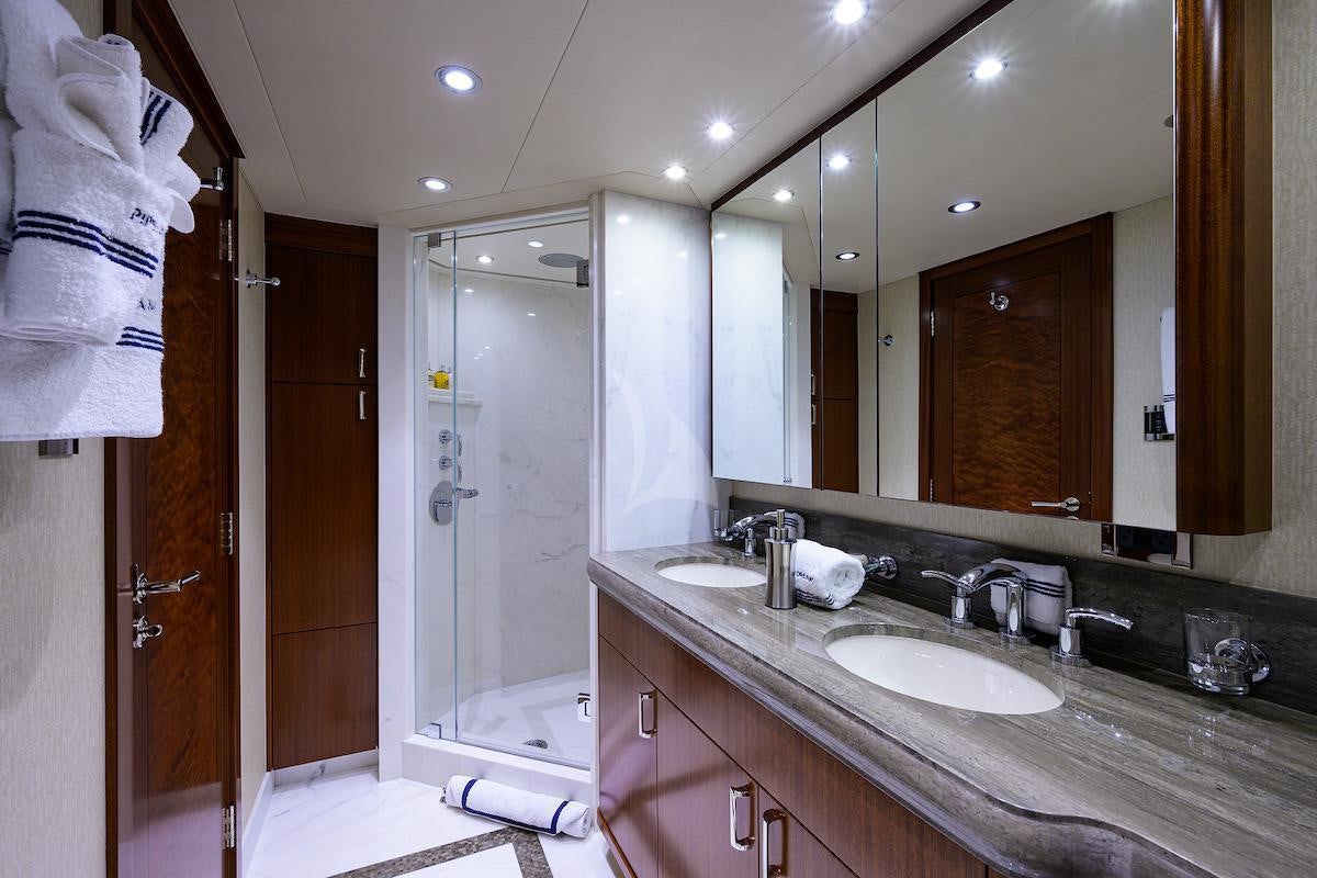 a bathroom with a large mirror aboard LADY JJ Yacht for Charter