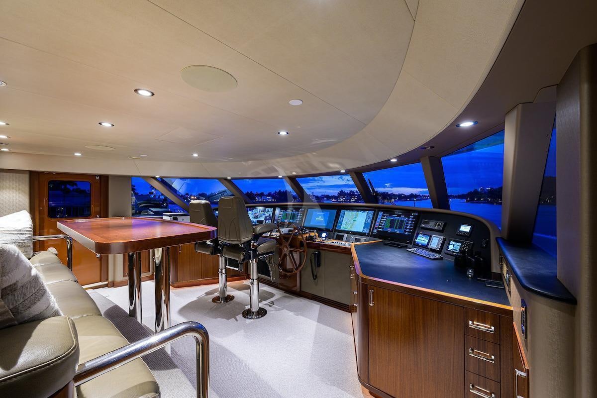 a room with a desk and chairs aboard LADY JJ Yacht for Charter