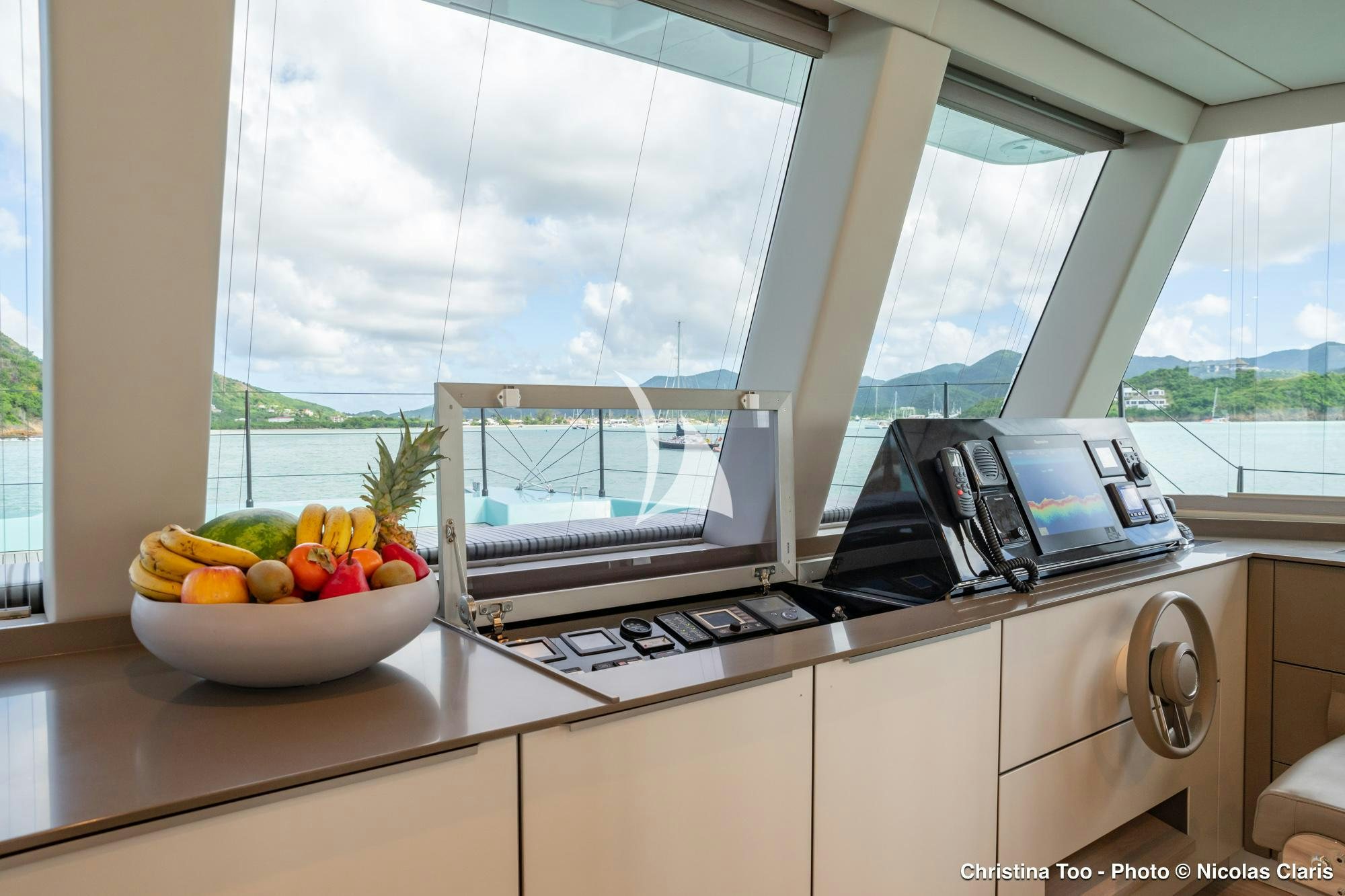a kitchen with a sink and a microwave aboard CHRISTINA TOO Yacht for Sale