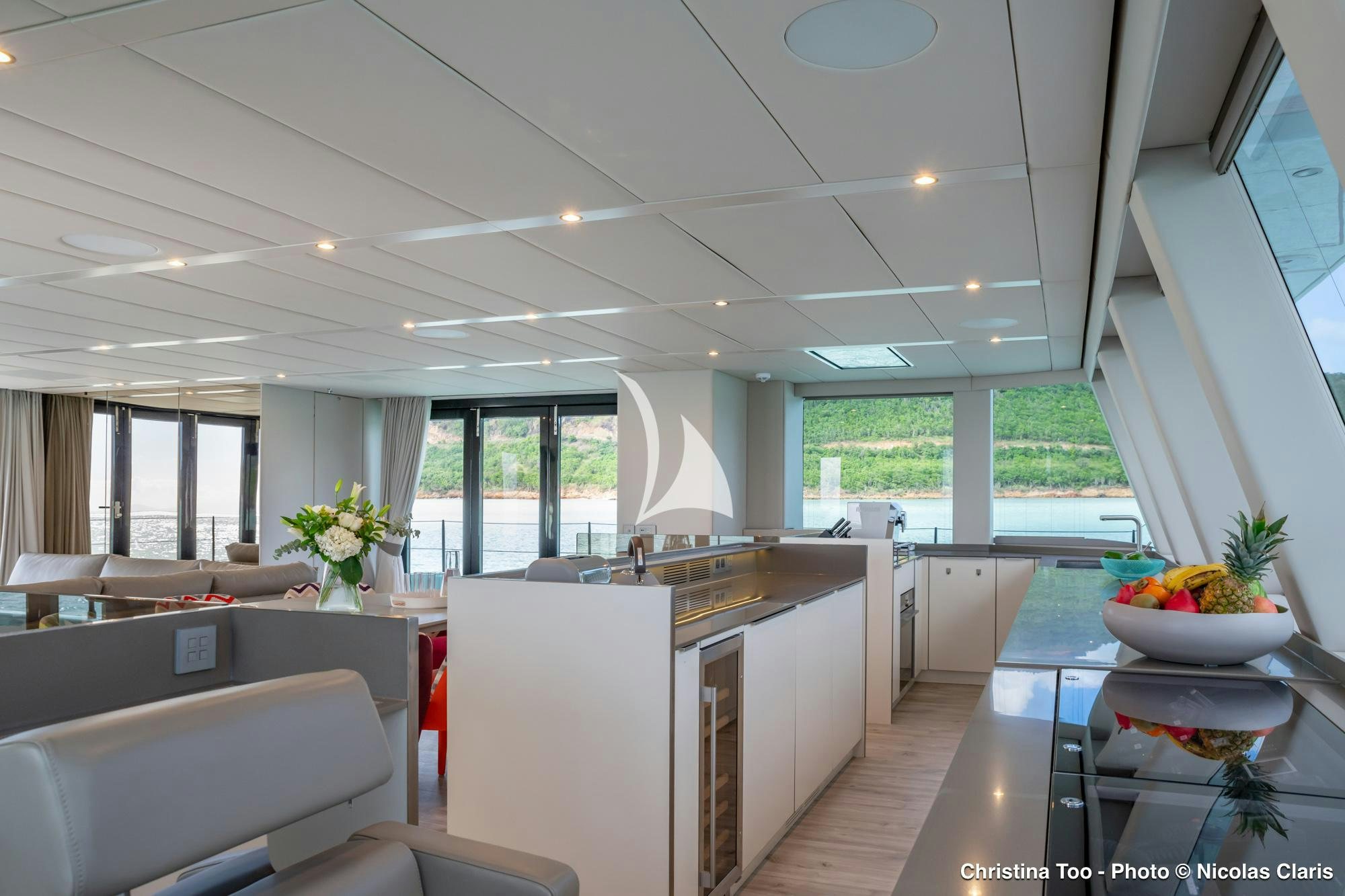 a large kitchen with a large island aboard CHRISTINA TOO Yacht for Sale