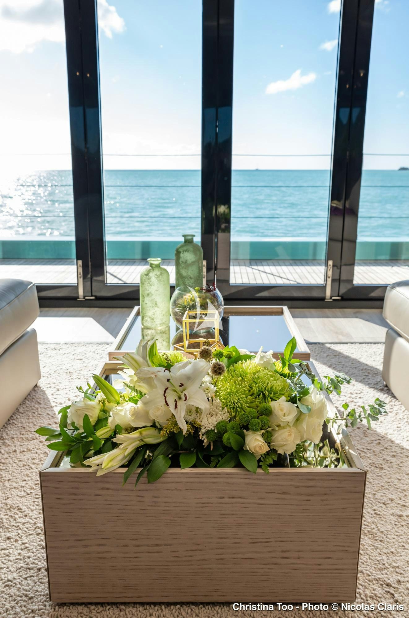 a vase of flowers on a table aboard CHRISTINA TOO Yacht for Sale