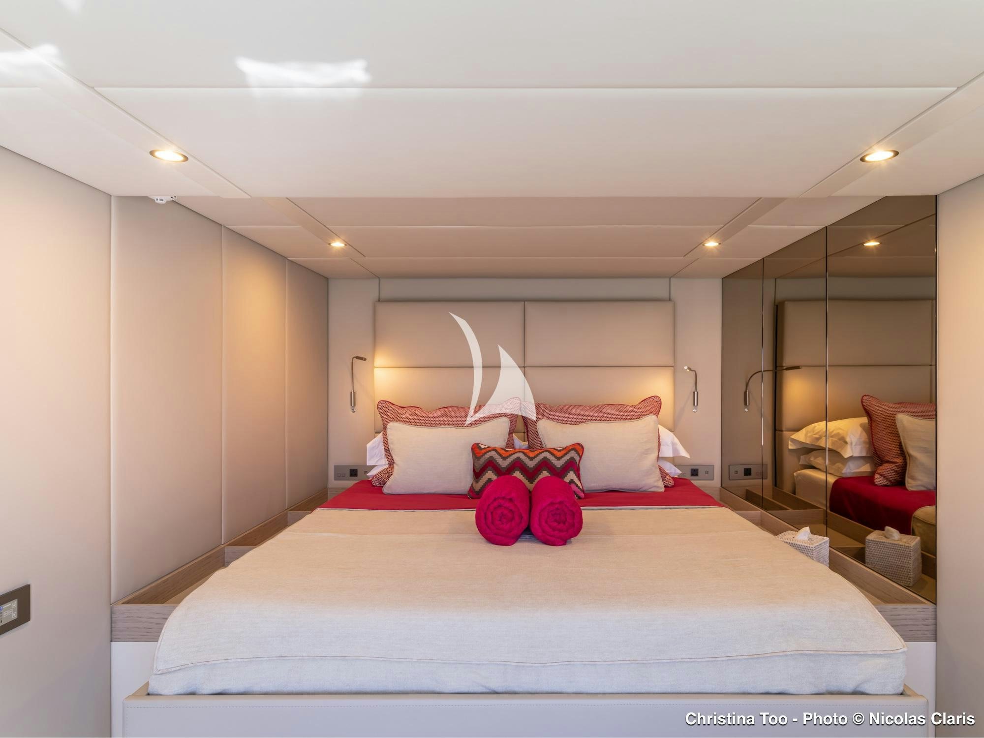 a bedroom with a bed and a couch aboard CHRISTINA TOO Yacht for Sale