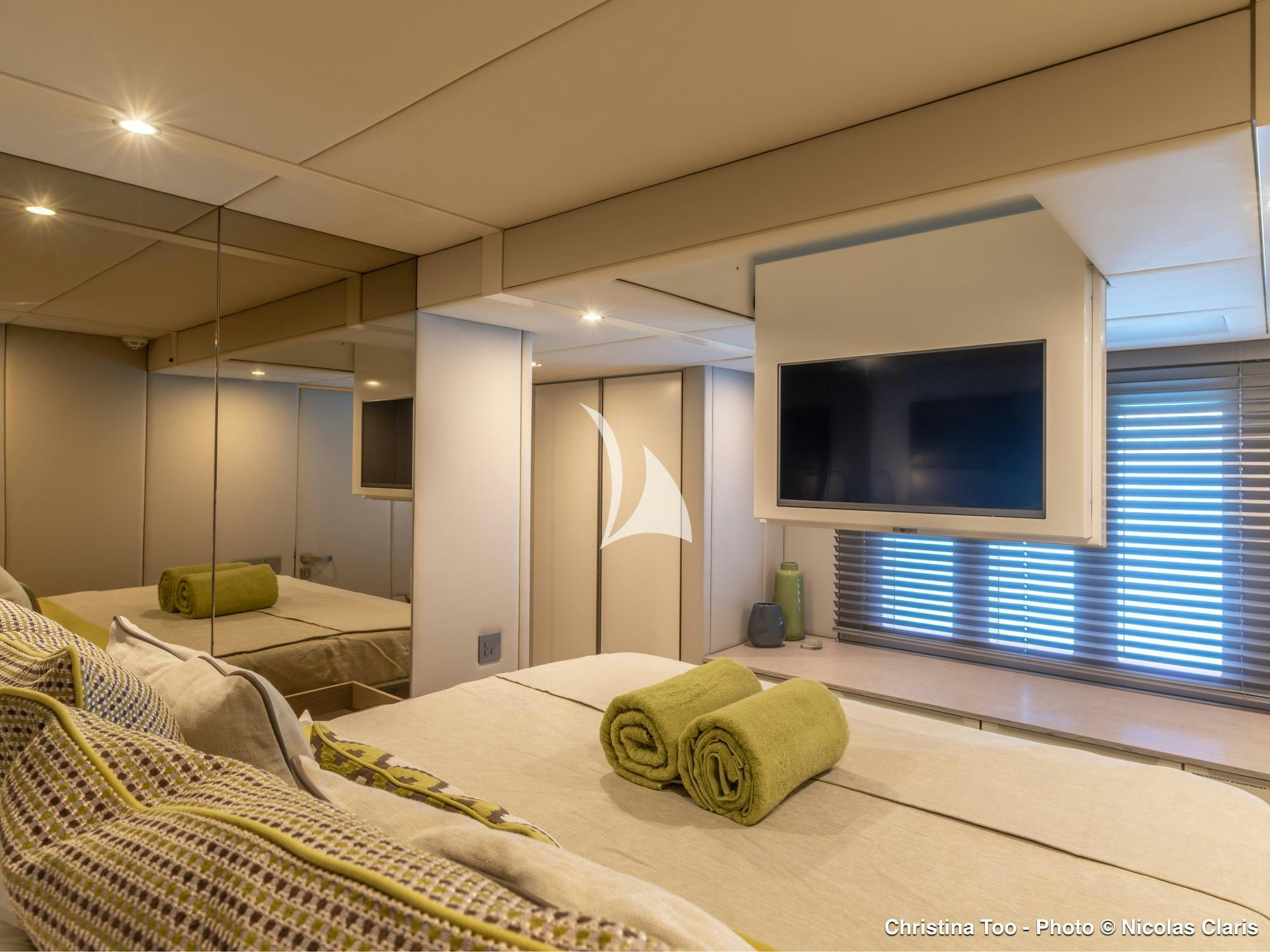 a bedroom with a large tv aboard CHRISTINA TOO Yacht for Sale