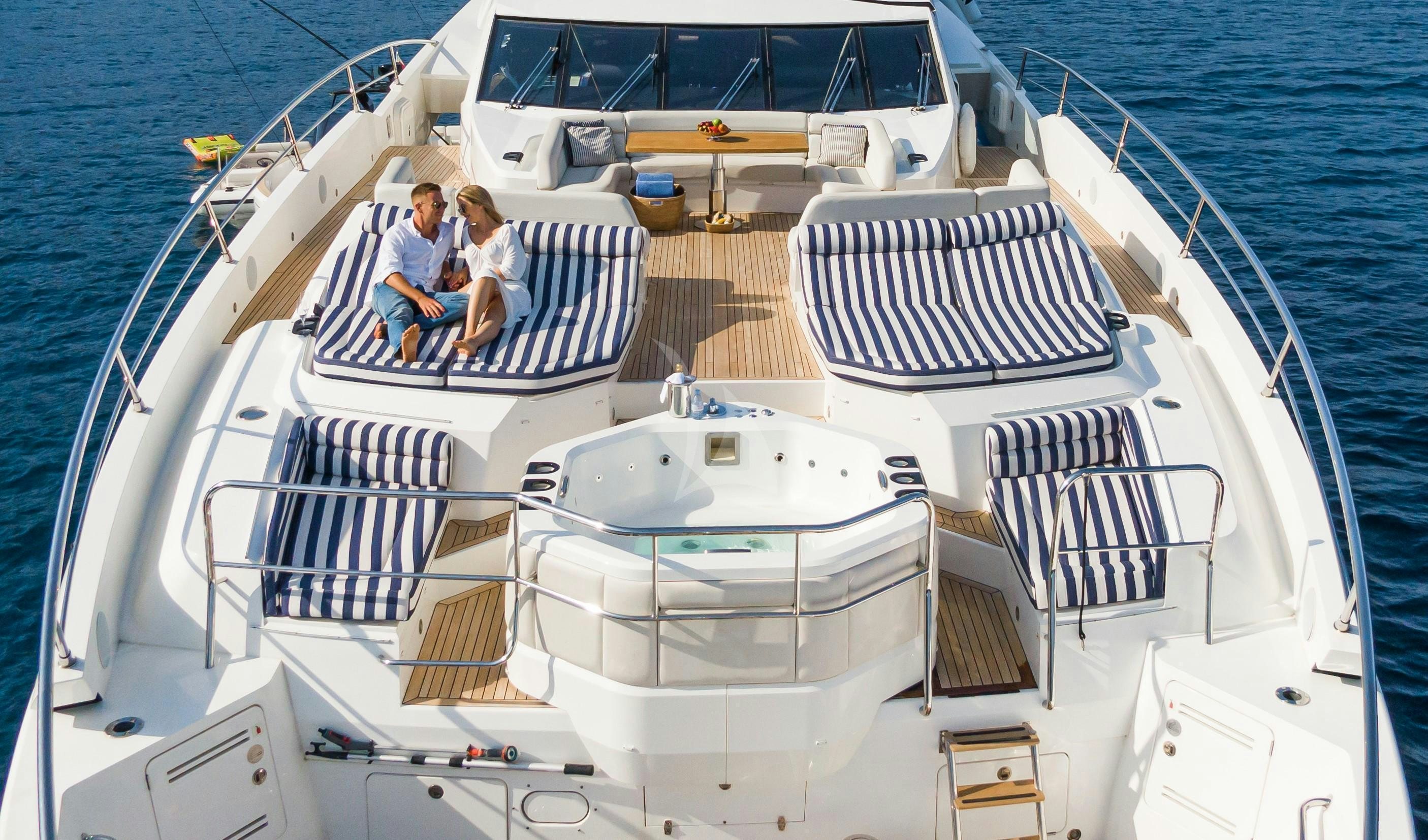 a couple sitting on a boat aboard FLEUR Yacht for Charter