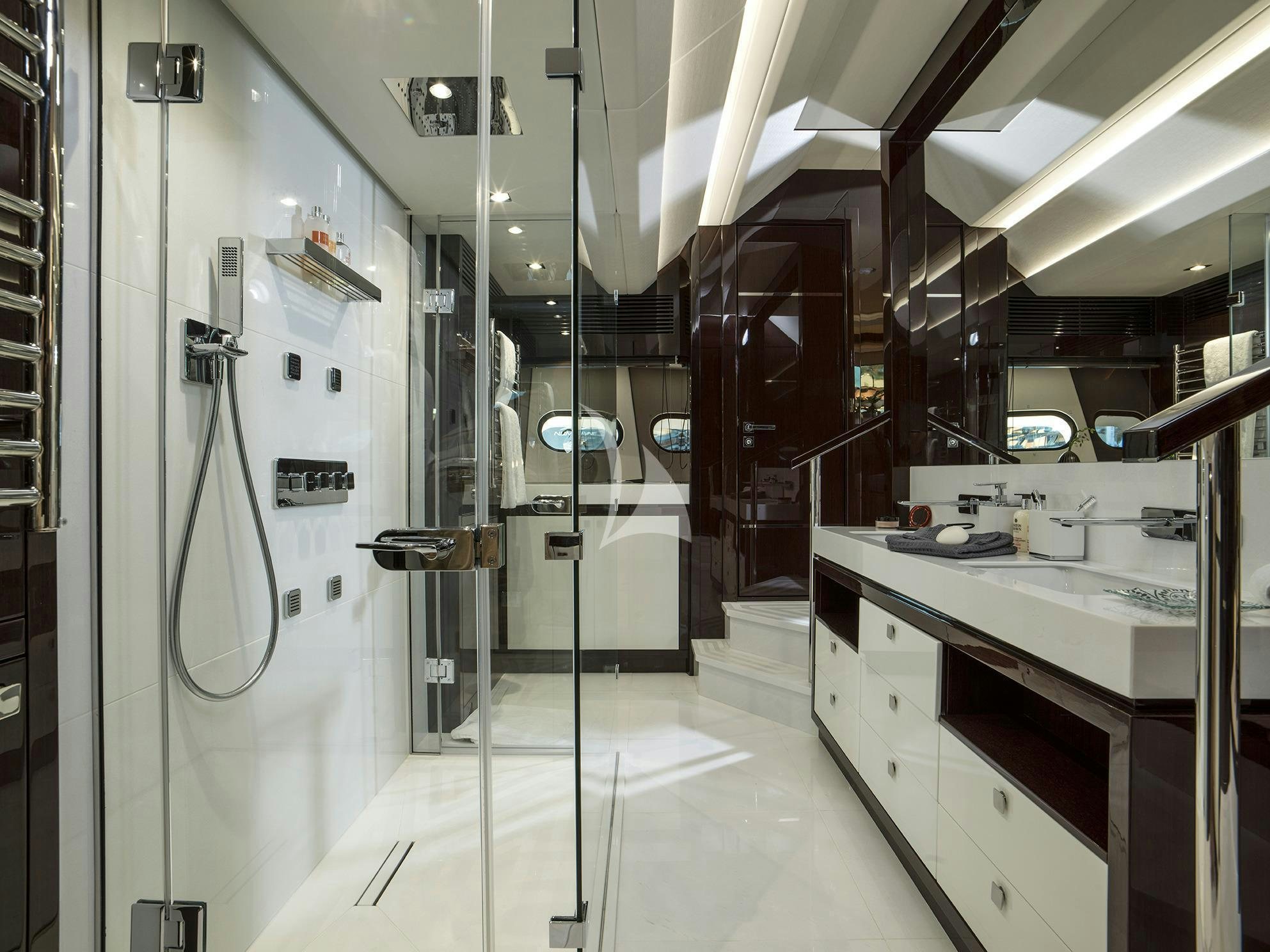 a bathroom with a shower unit aboard FLEUR Yacht for Charter