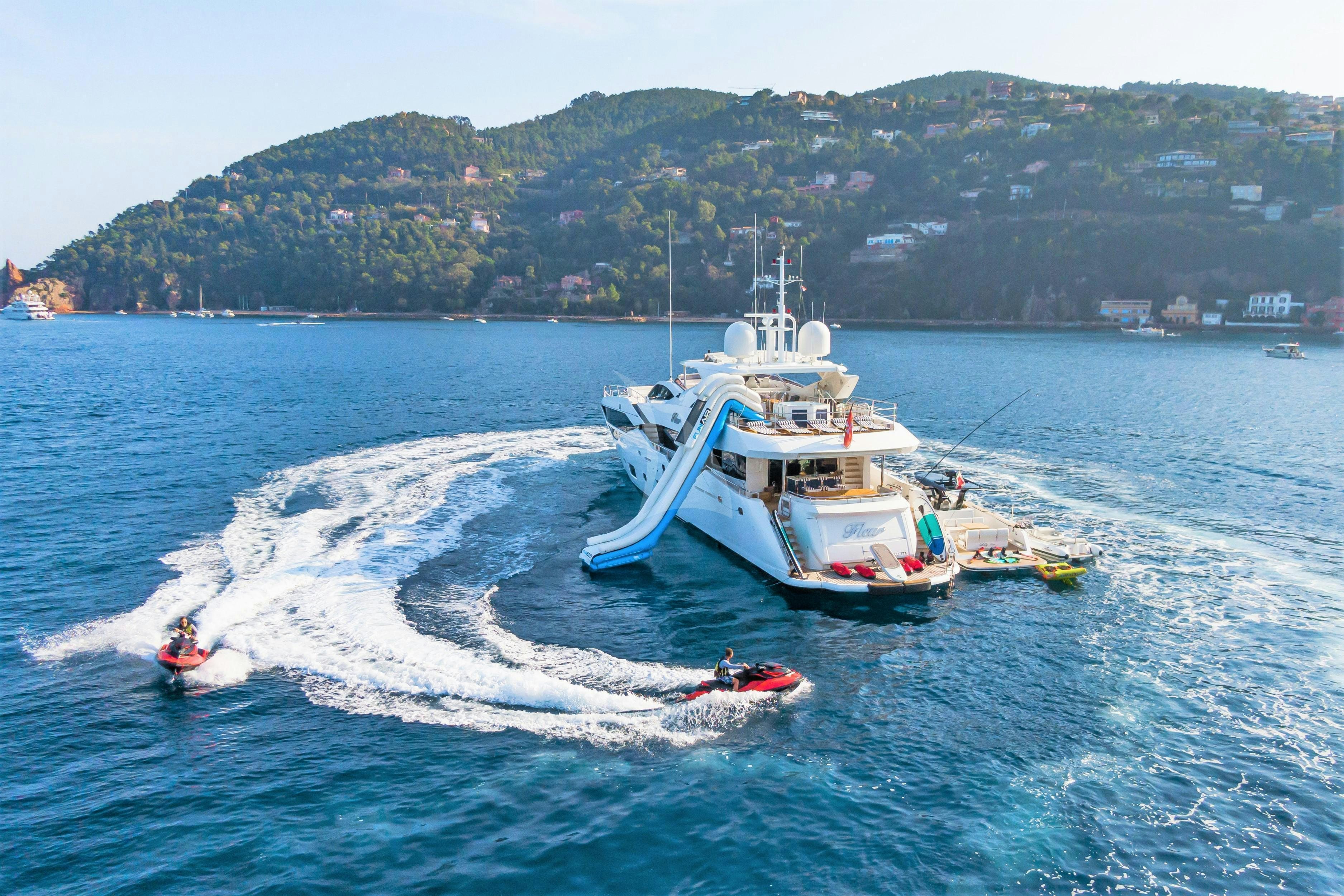 a boat and a person in the water aboard FLEUR Yacht for Charter