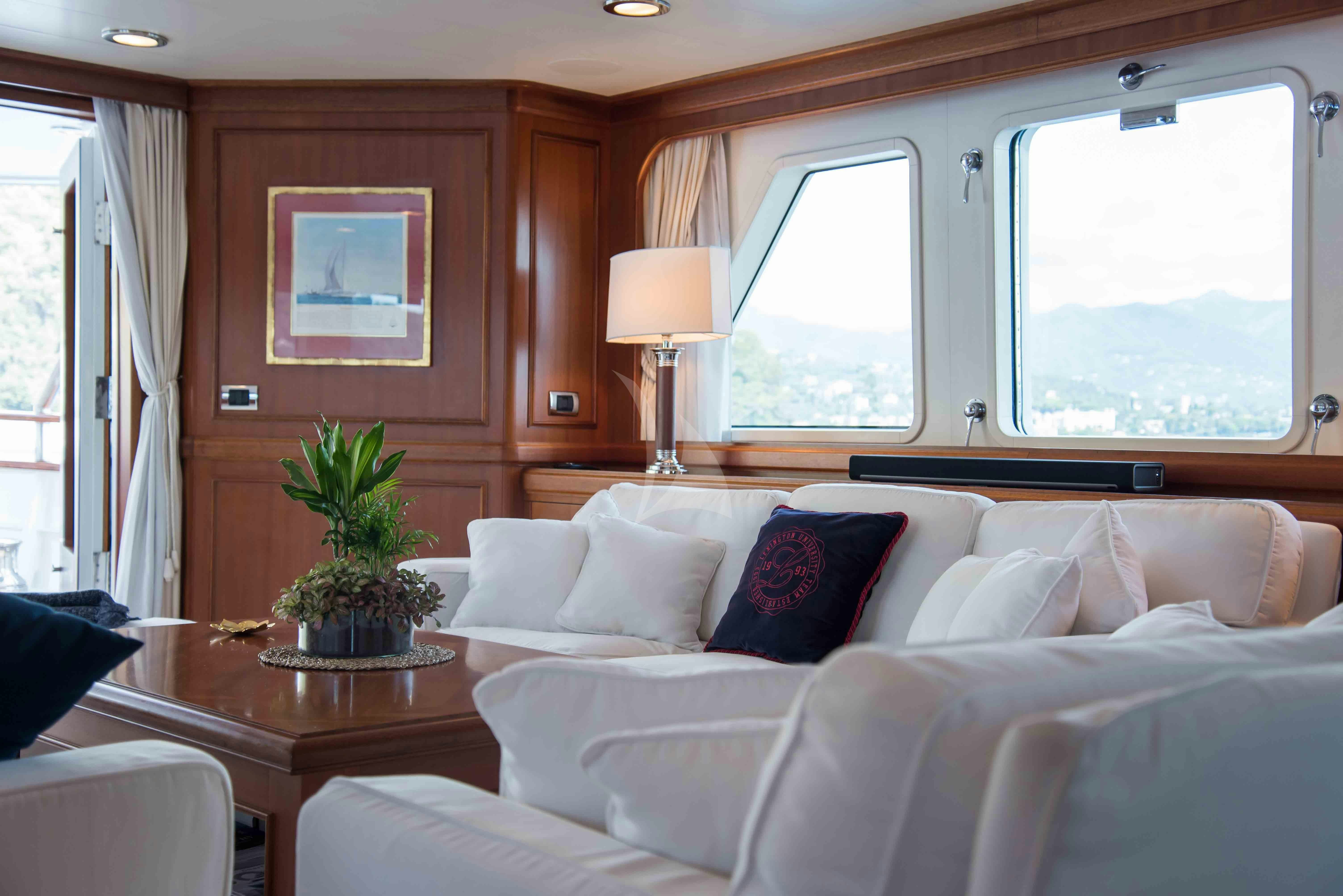 a living room with a couch and a table aboard ELENI Yacht for Charter