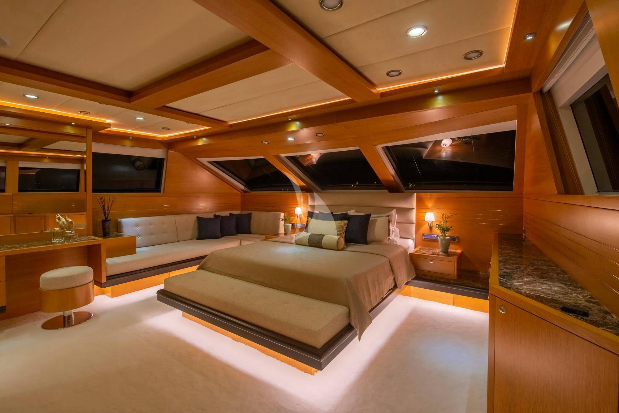 a room with a couch and a tv aboard PANFELISS Yacht for Charter