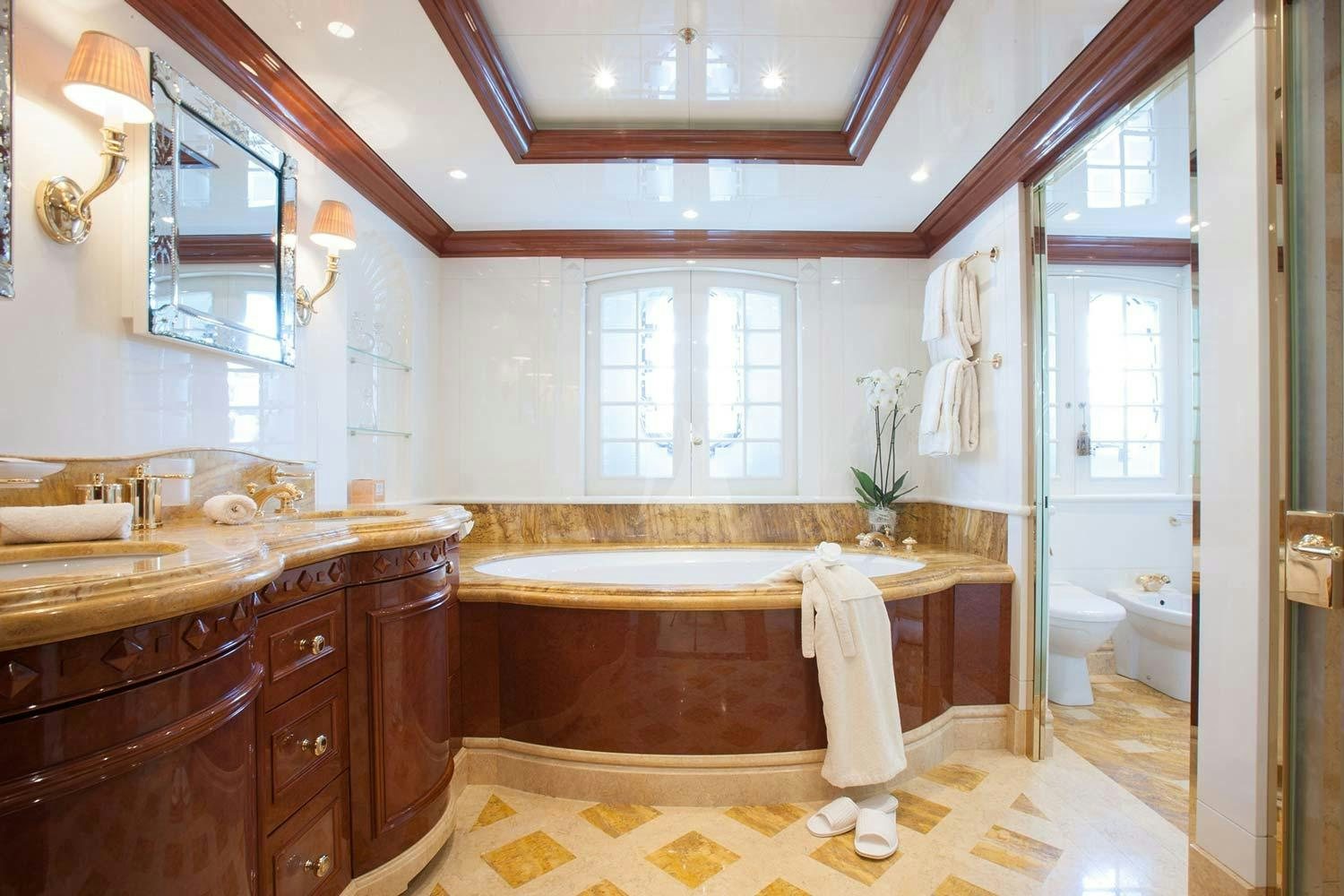 a bathroom with a tub sink and cabinets aboard ST DAVID Yacht for Charter
