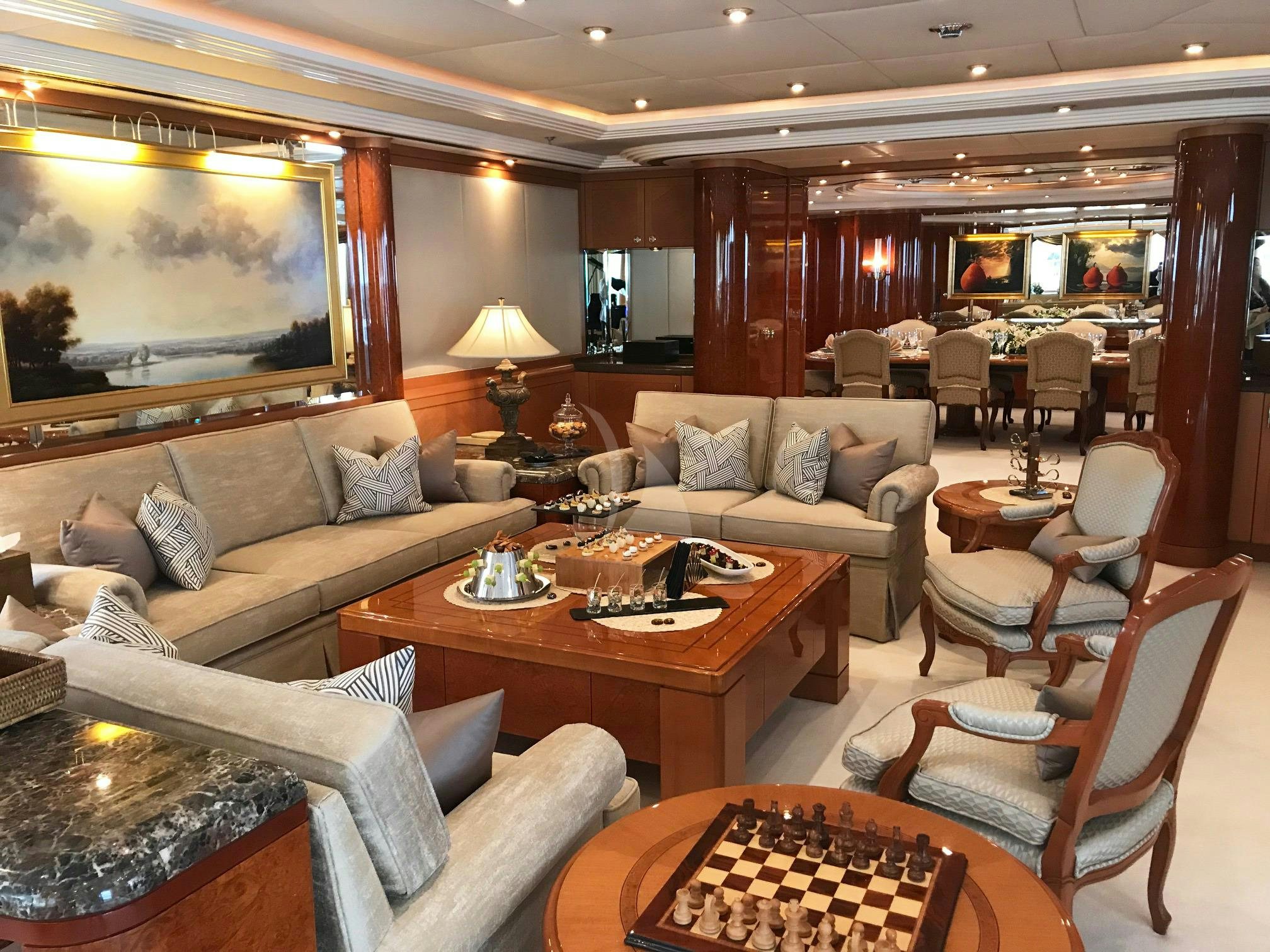 a living room with a large screen aboard CAPRI I Yacht for Charter