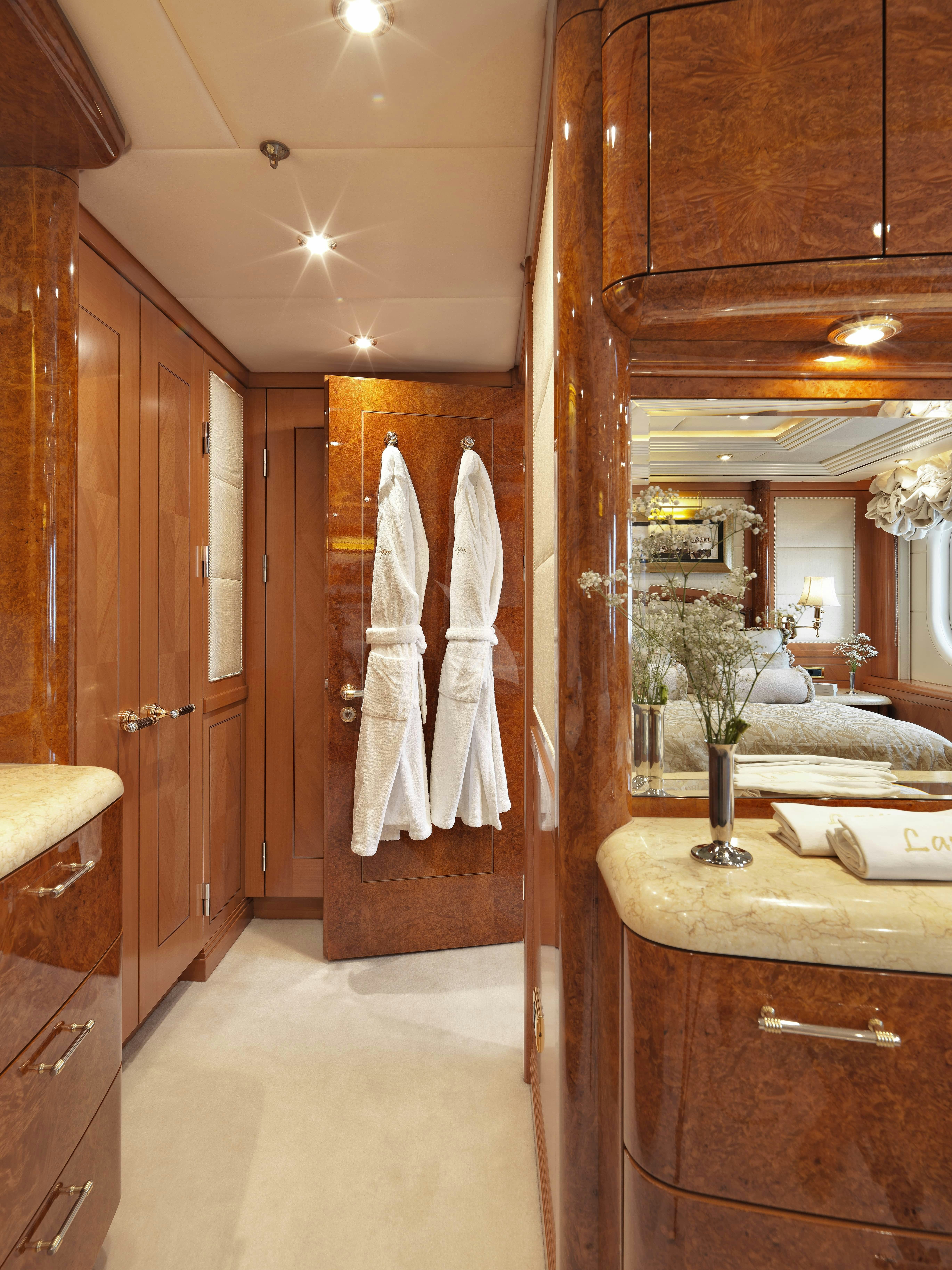 a bathroom with a large mirror aboard CAPRI I Yacht for Charter