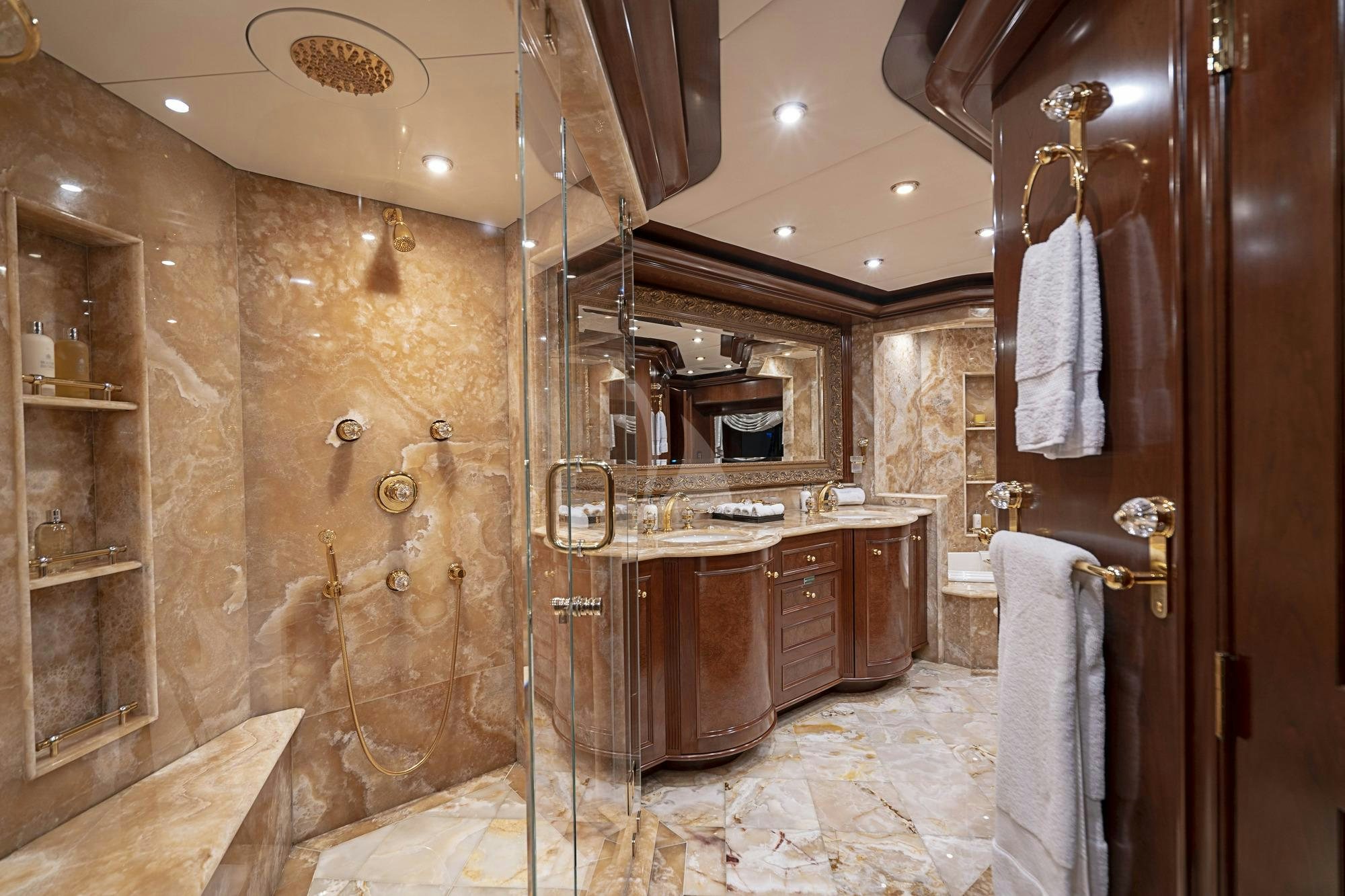 a bathroom with a shower and sink aboard AQUASITION Yacht for Charter
