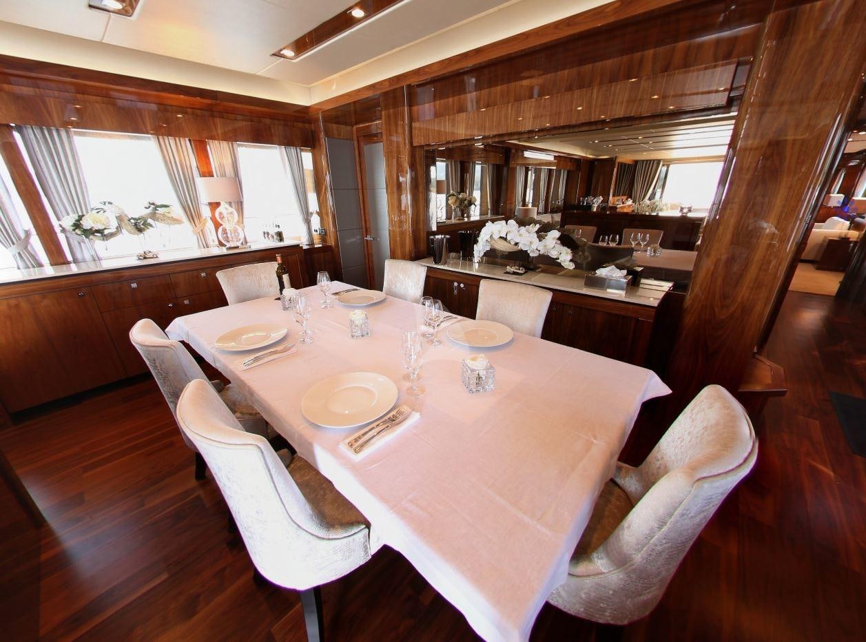 a dining room with a table aboard MAORO Yacht for Charter