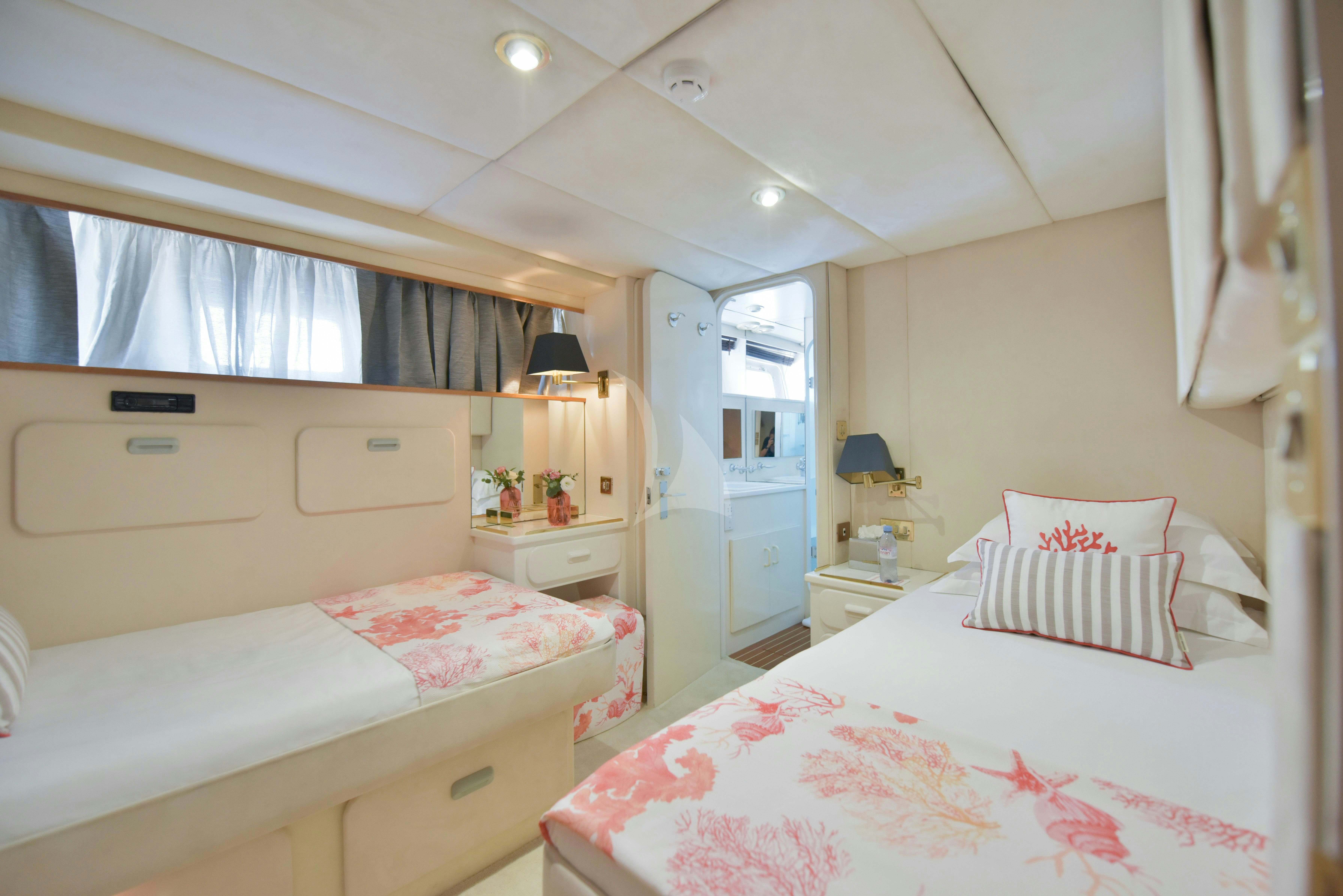 a couple of beds in a small room aboard ATLANTIC ENDEAVOUR Yacht for Charter
