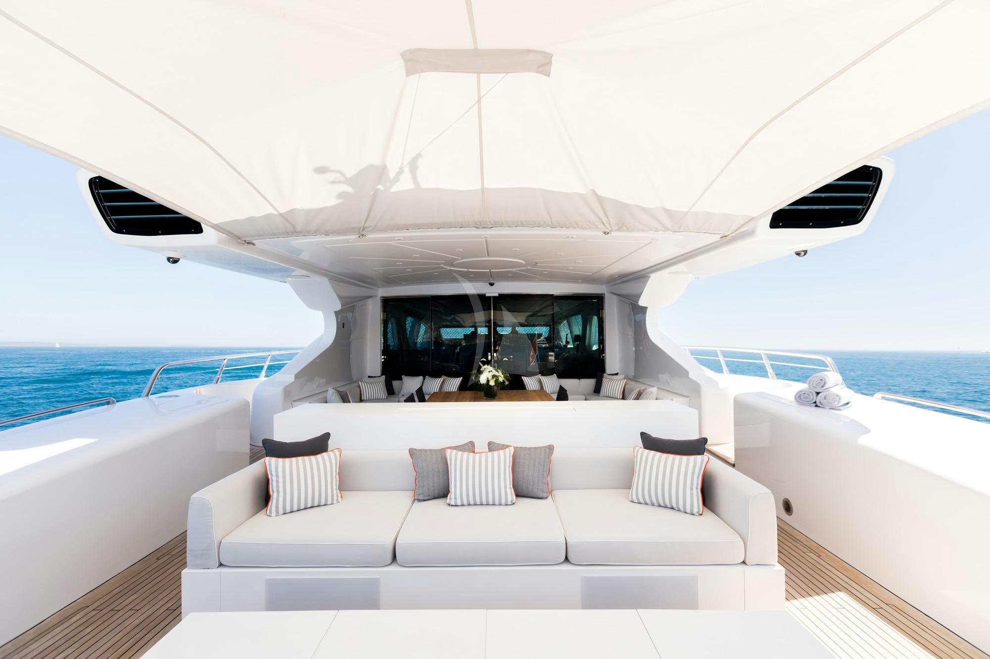 a white lounge chair on a boat aboard BEACHOUSE Yacht for Charter