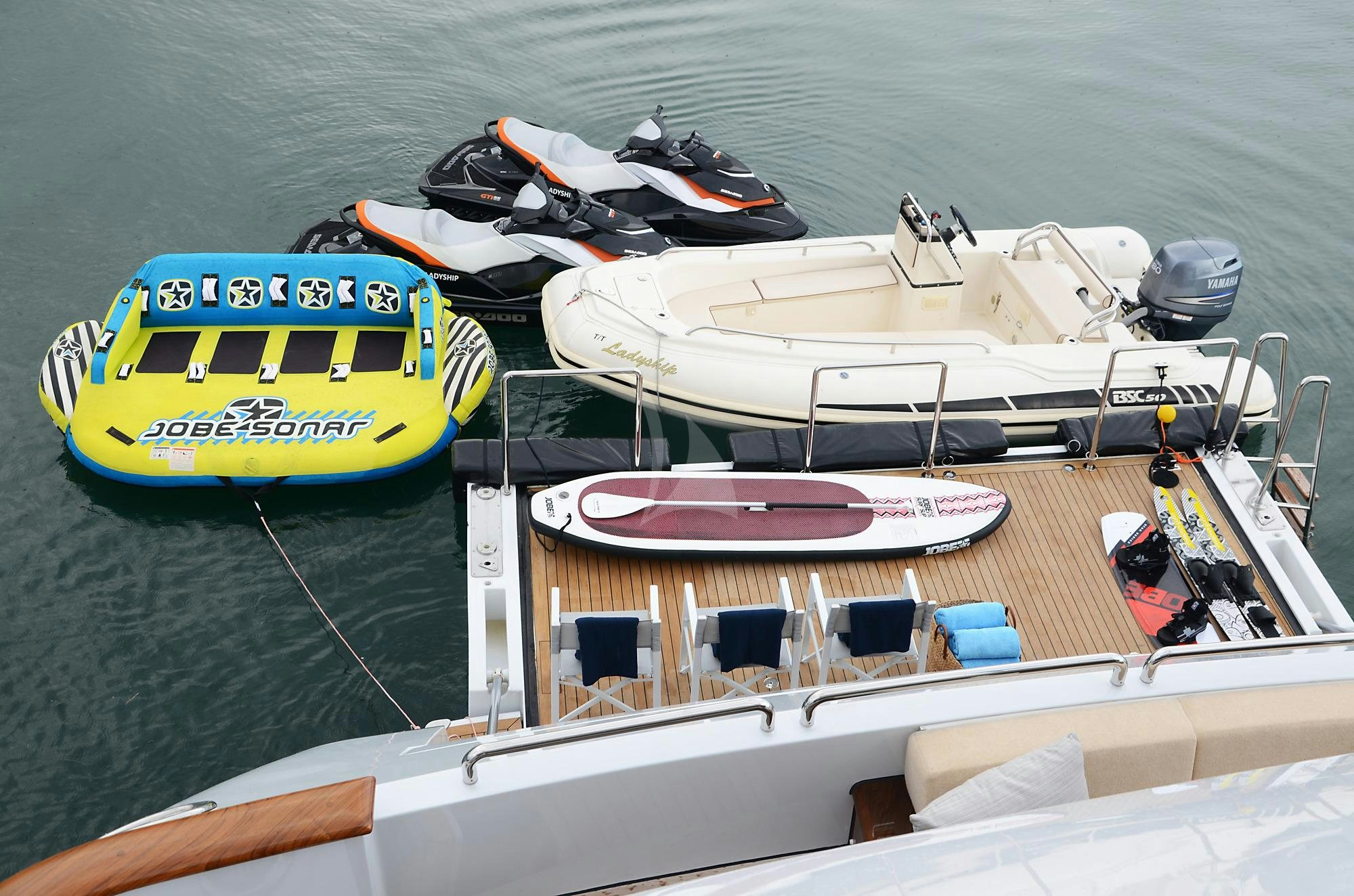 a boat with a boat on it aboard LADYSHIP Yacht for Charter