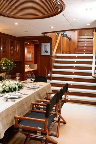 a dining room with a staircase aboard GITANA Yacht for Charter