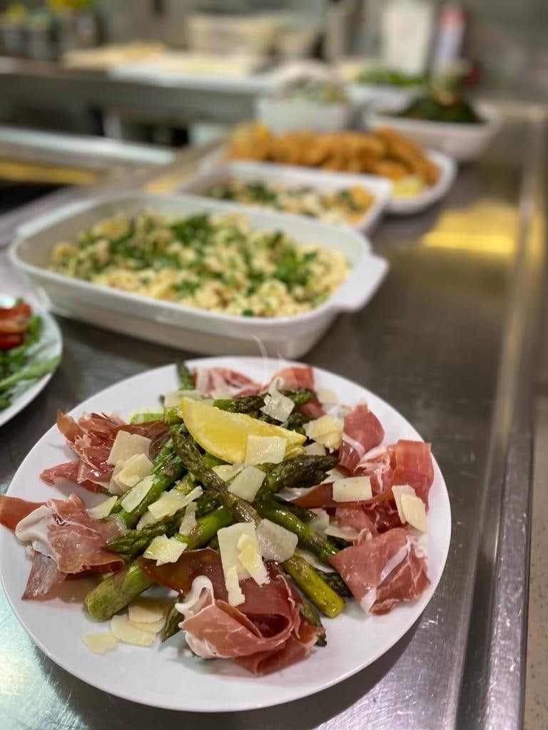 a table full of food aboard CAROM Yacht for Charter