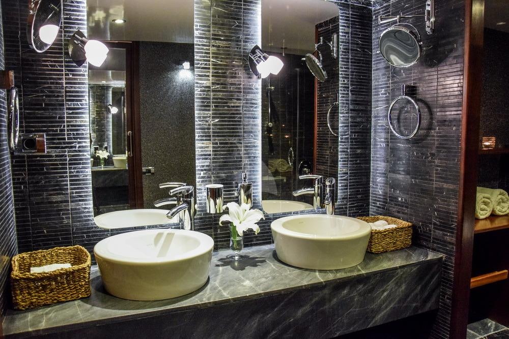 a bathroom with sinks and mirrors aboard PAPA JOE Yacht for Charter