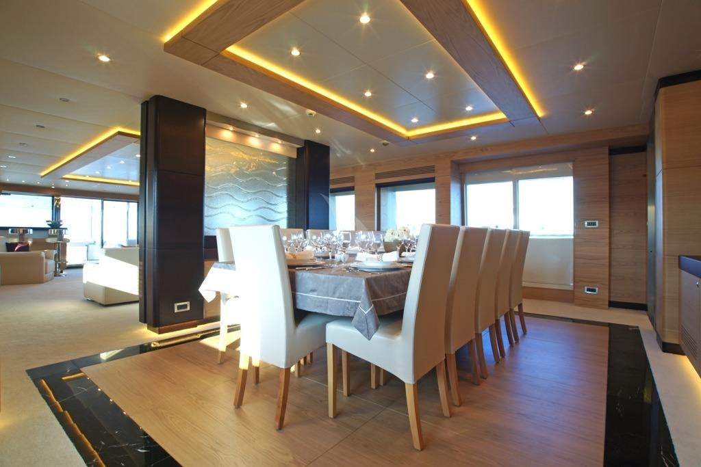 a room with tables and chairs aboard TATIANA I Yacht for Charter