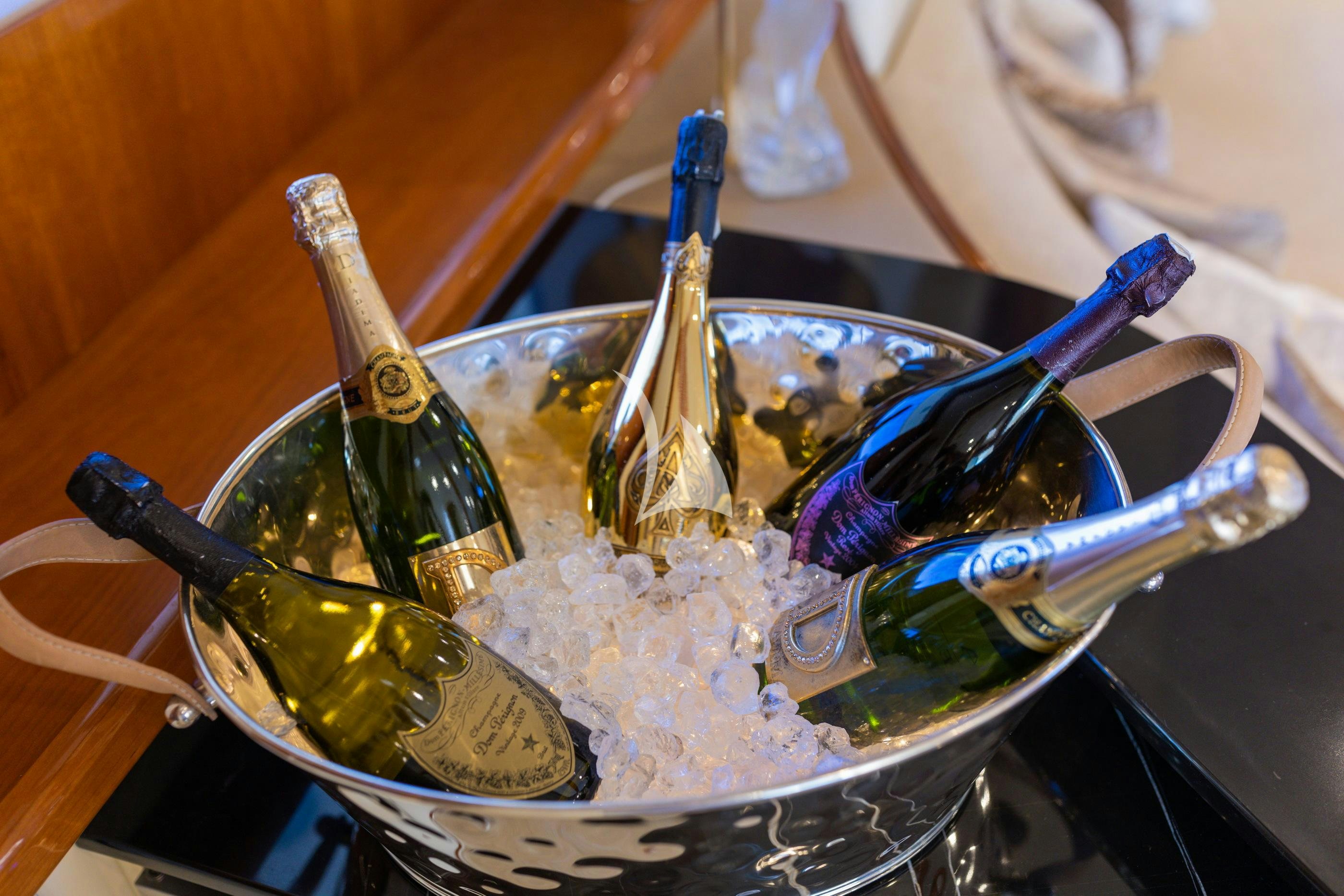 a bowl of ice cream and a couple of glasses with a spoon in it aboard NOVELA Yacht for Charter