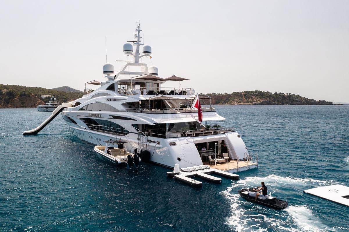 a large ship in the water aboard ILLUSION V Yacht for Charter