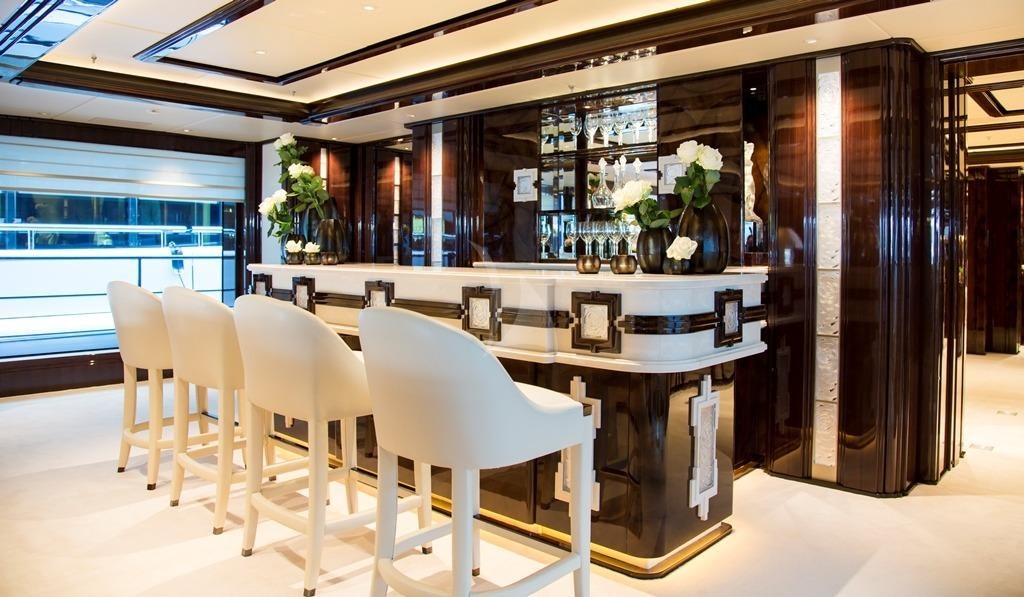 a room with a table and chairs aboard ILLUSION V Yacht for Charter