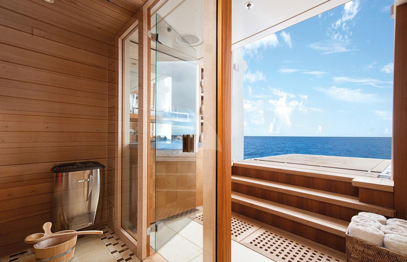 a bathroom with a large glass shower aboard LADY BRITT Yacht for Charter