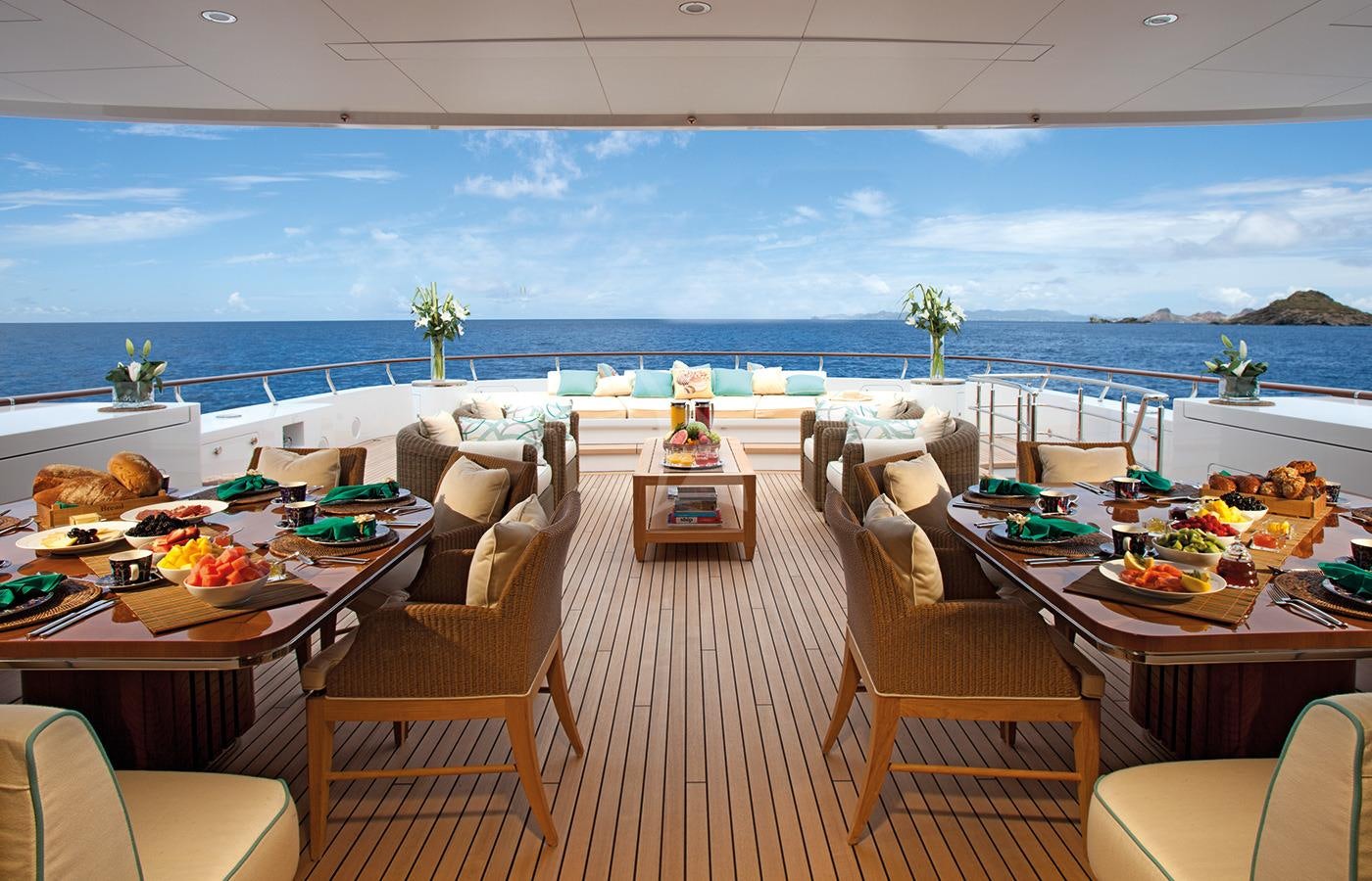 a room with tables and chairs aboard LADY BRITT Yacht for Charter