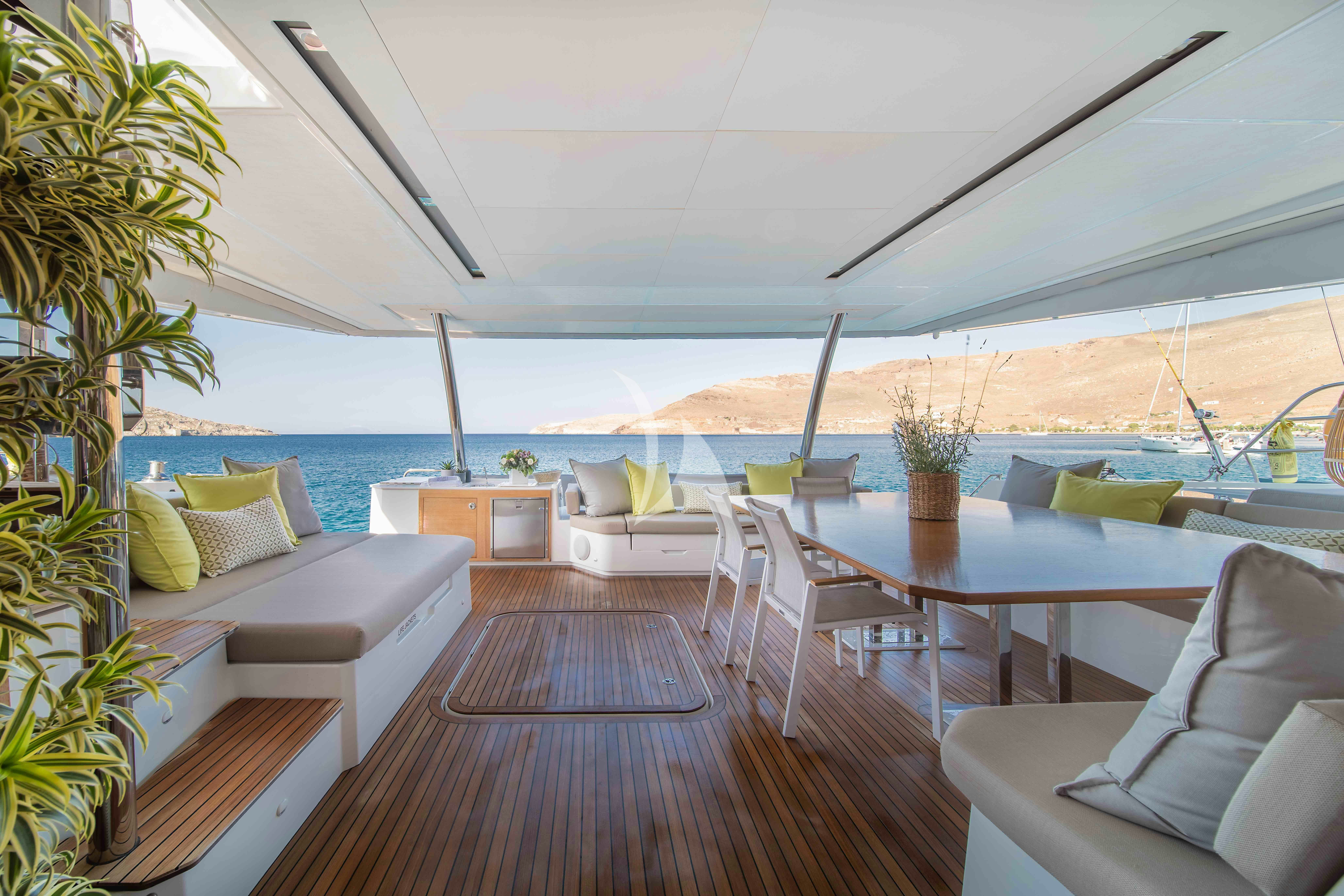 a balcony with a view of the ocean and the ocean aboard AETHER Yacht for Charter