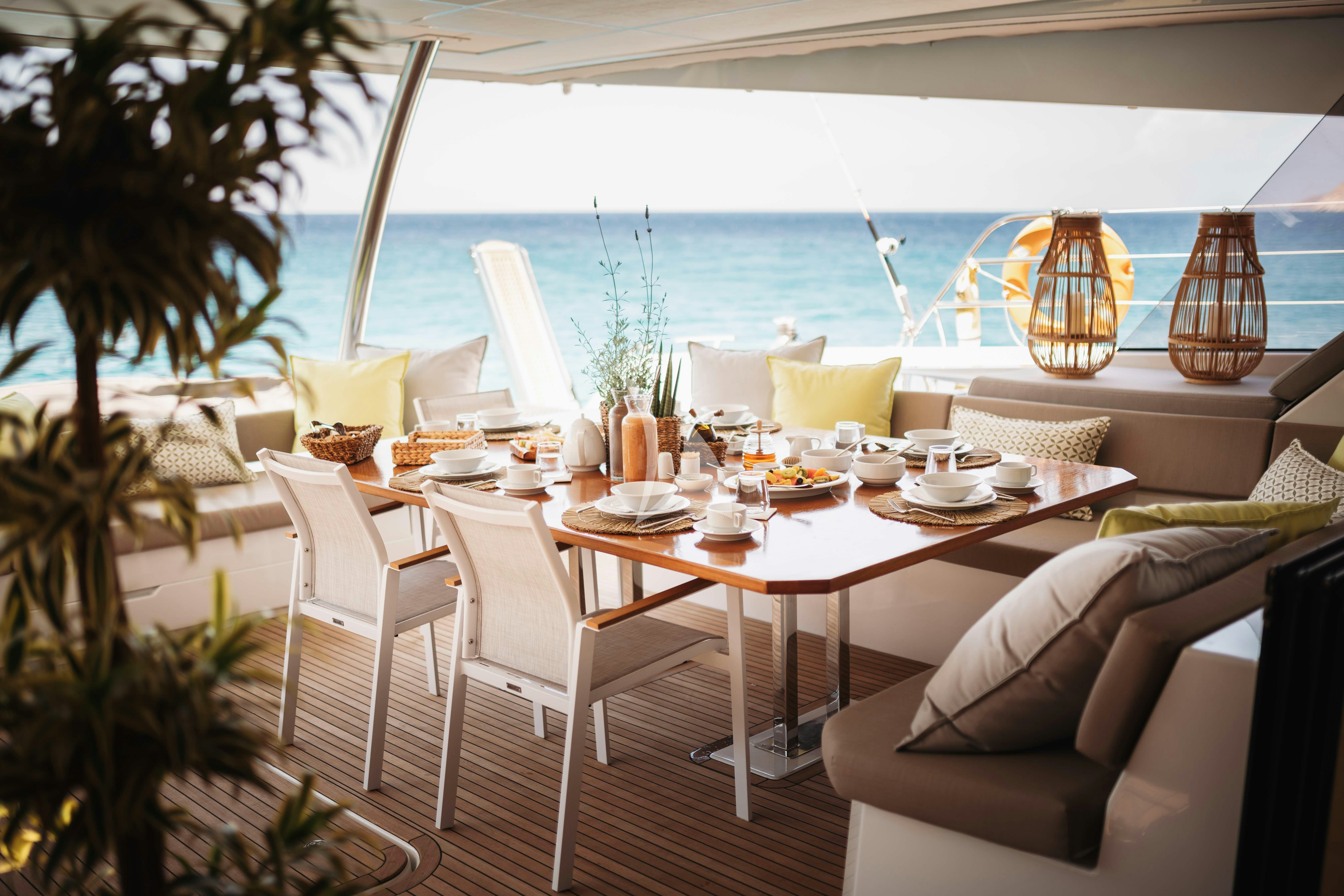 a table set for a meal aboard AETHER Yacht for Charter