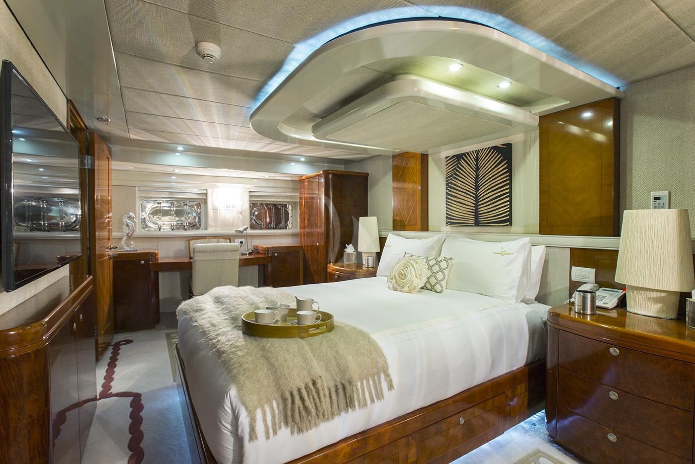 a large bedroom with a large bed aboard PRINCESS ILUKA Yacht for Charter