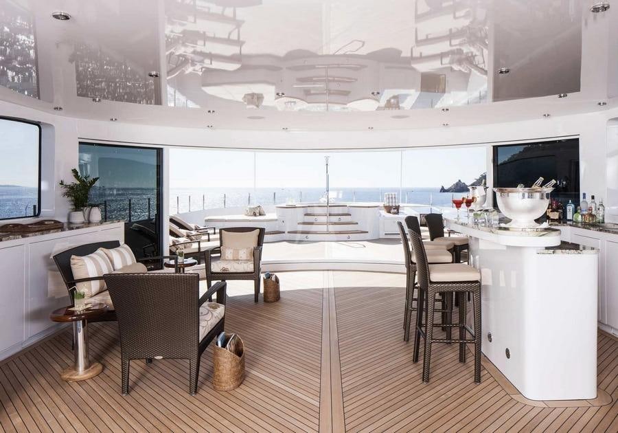 a modern kitchen with white cabinets aboard LIBERTY Yacht for Charter