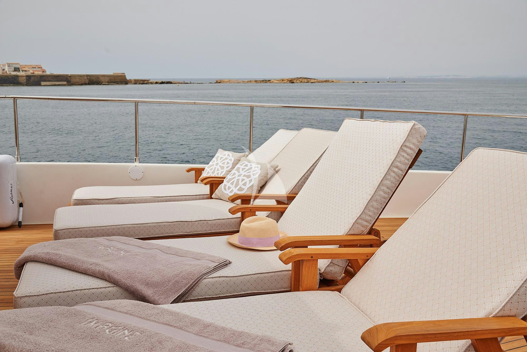 a lounge chair on a boat aboard IMAGINE Yacht for Charter