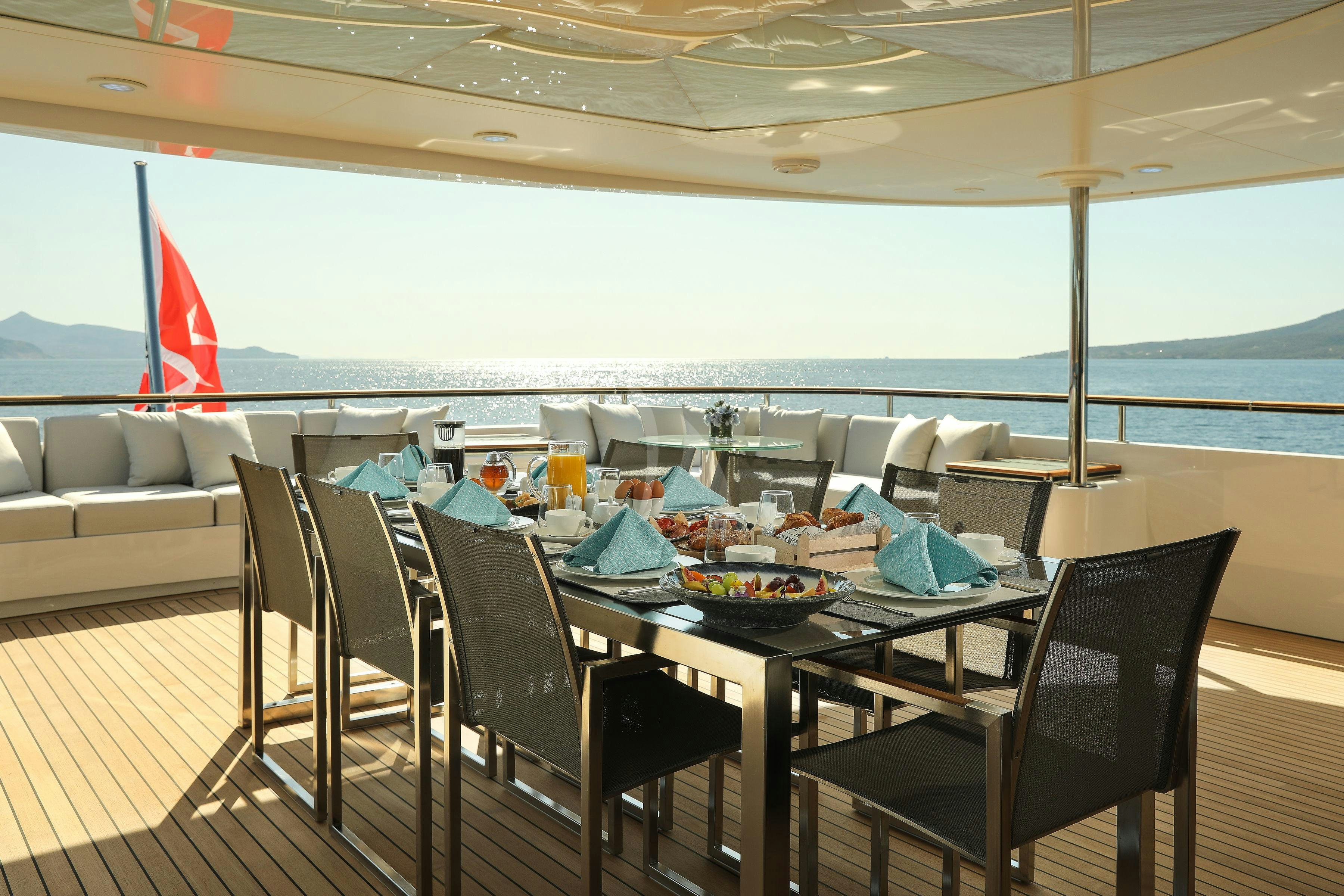 a table set for a meal aboard VERTIGO Yacht for Charter
