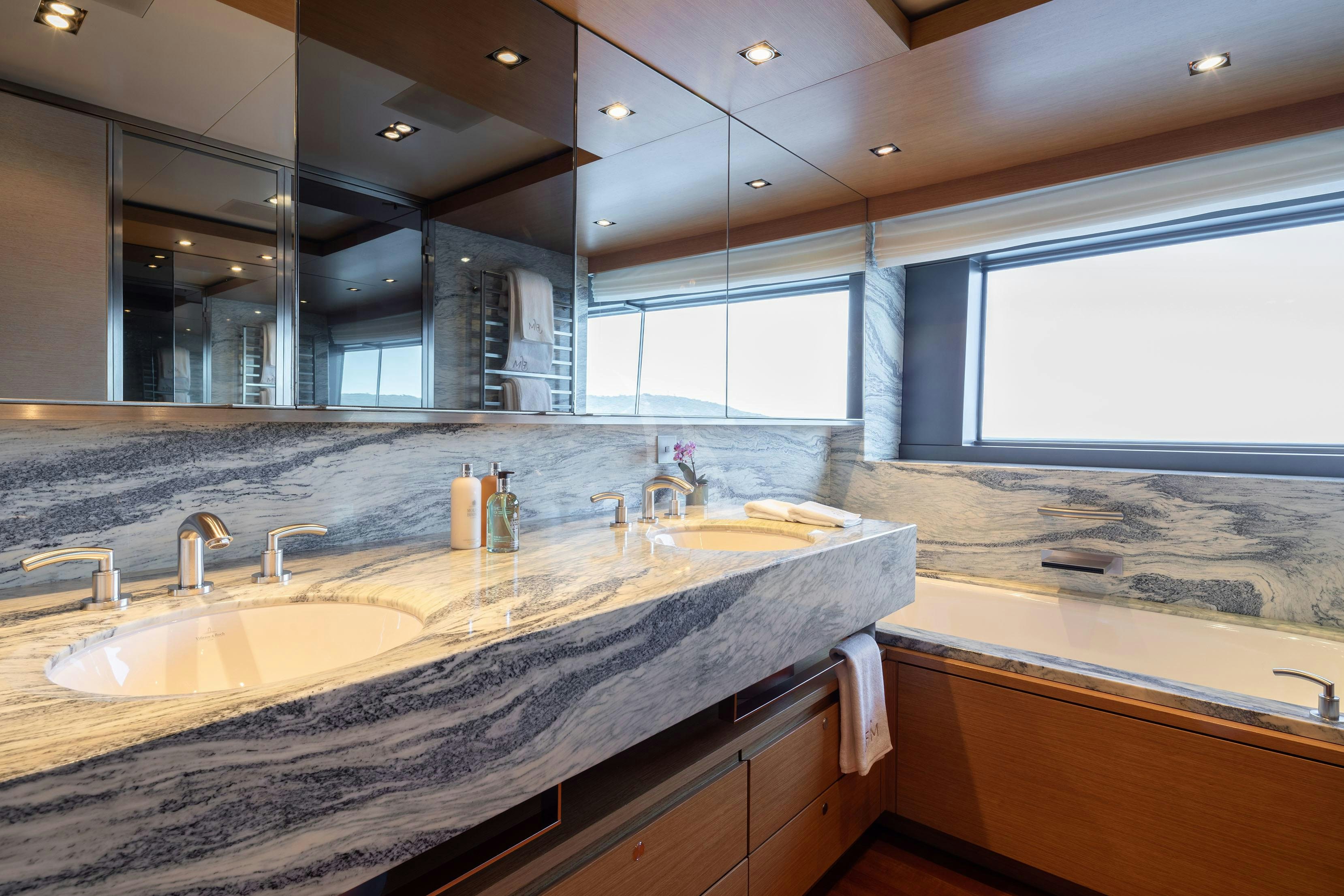 a bathroom with a large countertop aboard FALCO MOSCATA Yacht for Charter