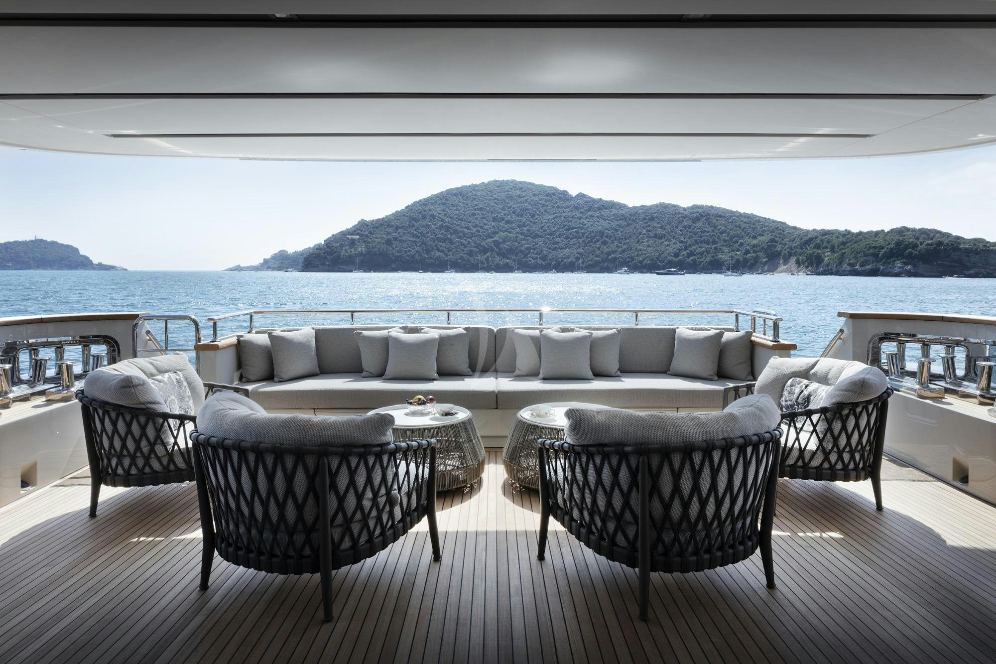 a patio with chairs and tables aboard NAMASTE Yacht for Charter