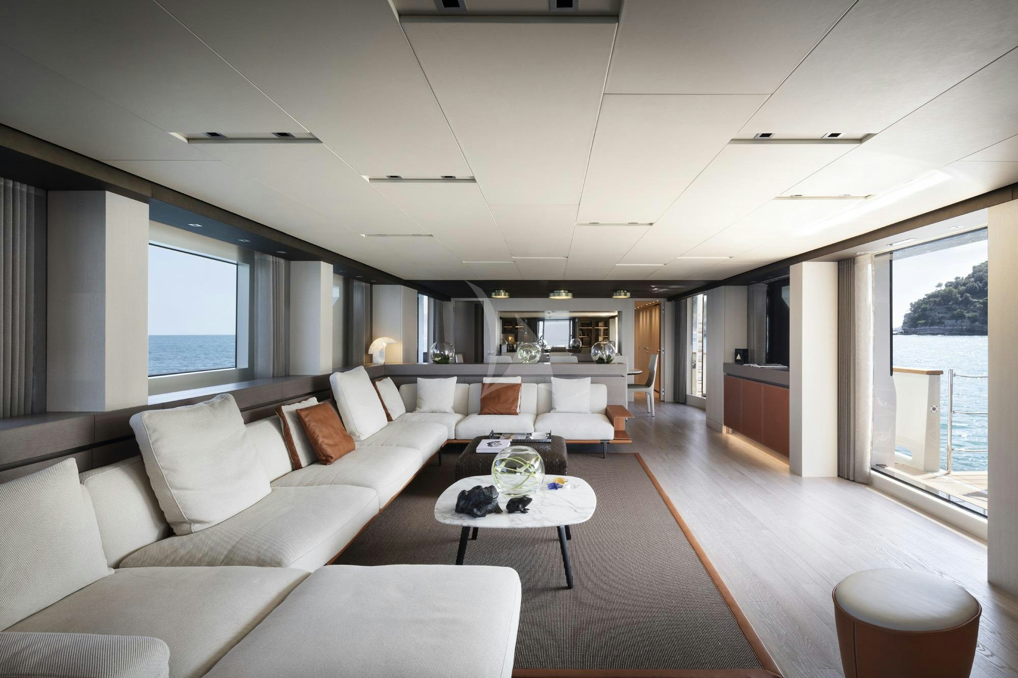 a living room with a large window aboard NAMASTE Yacht for Charter